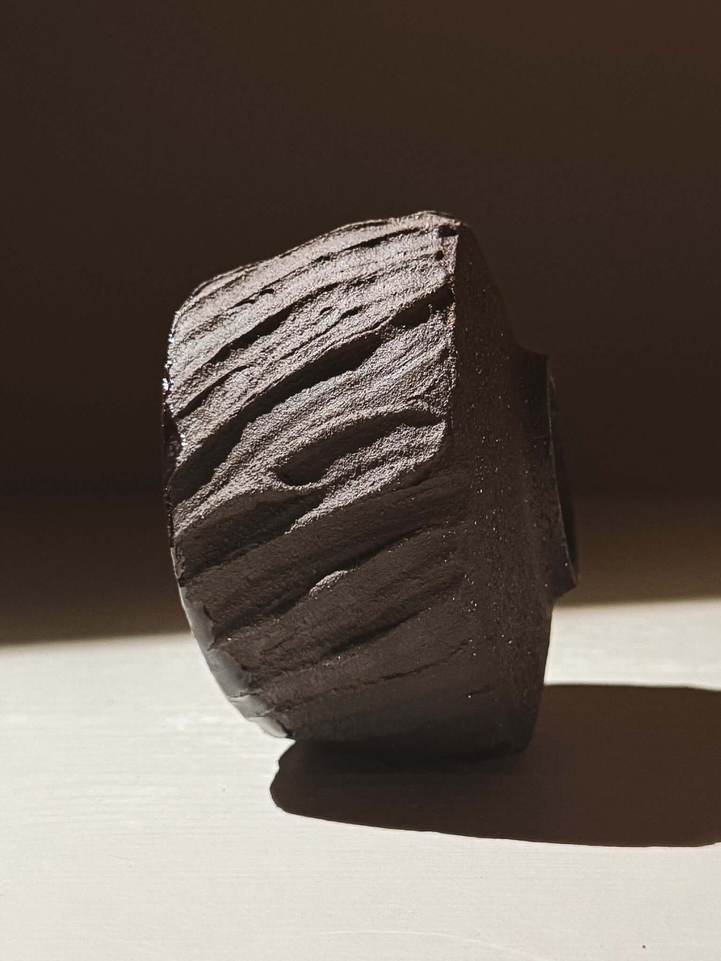 Yunomi Cup - Kuro #01 featuring textured dark brown clay, inspired by volcanic stone and earthy tones.