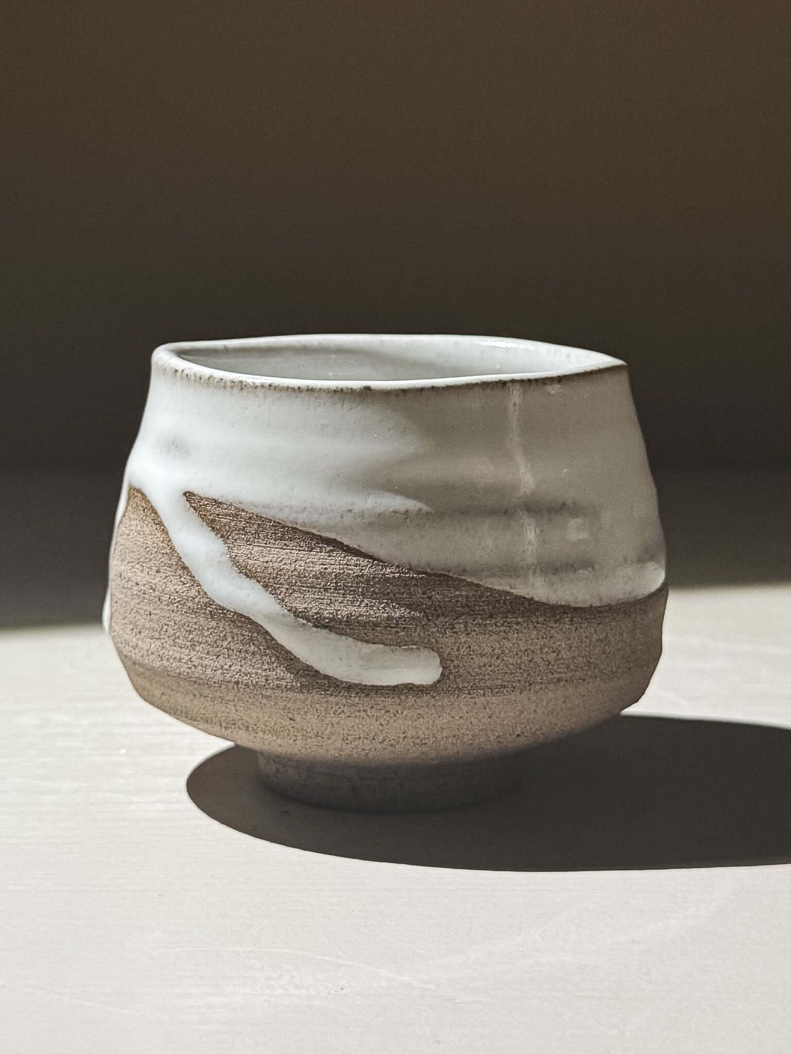 Yunomi Cup - Yuki Ash #02 showcasing soft glossy white glaze over textured ash-grey stoneware.
