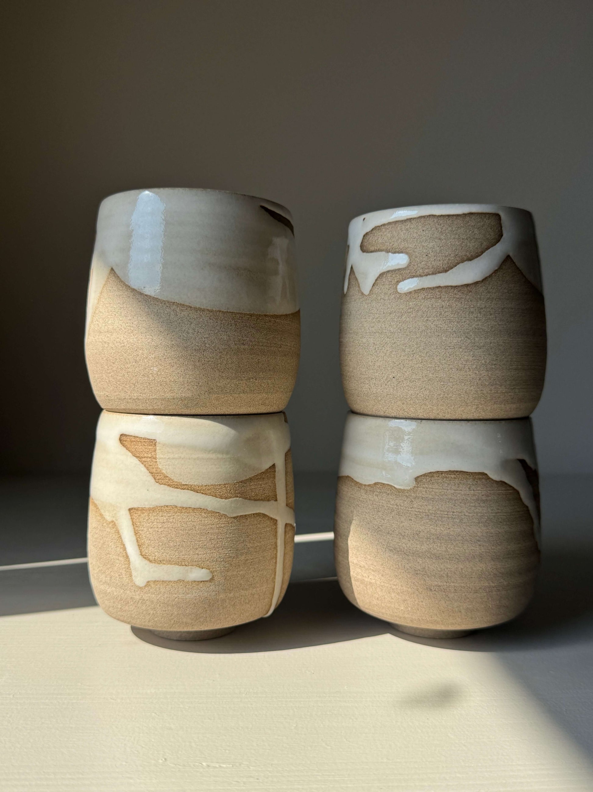 Yunomi Cups - Yuki handmade ceramic with white glaze on toffee clay, showcasing unique textures and gentle tonal shifts.