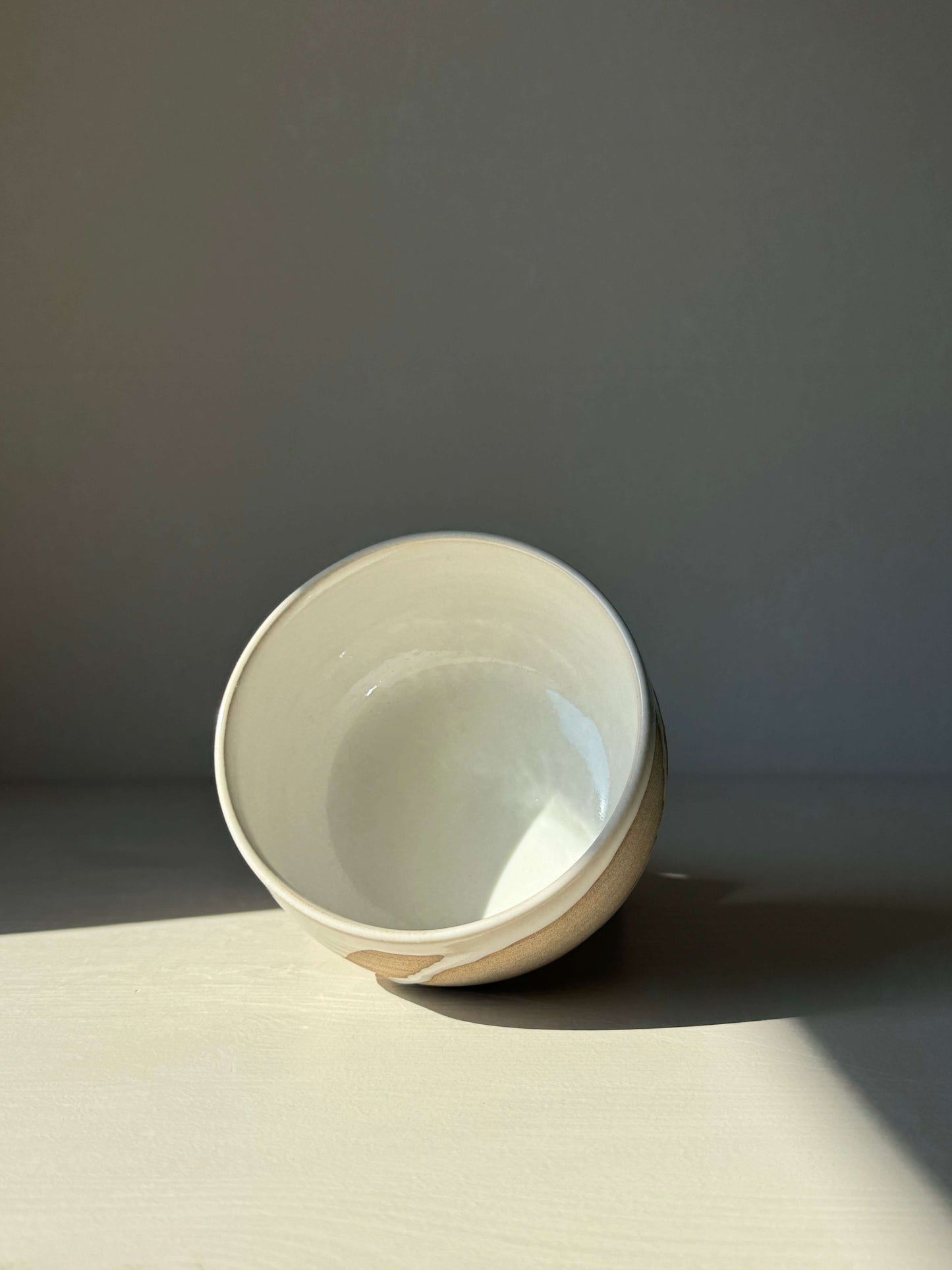 Handmade Matcha bowl from Yuki Series, featuring toffee clay and glossy white glaze, perfect for a calming daily ritual.