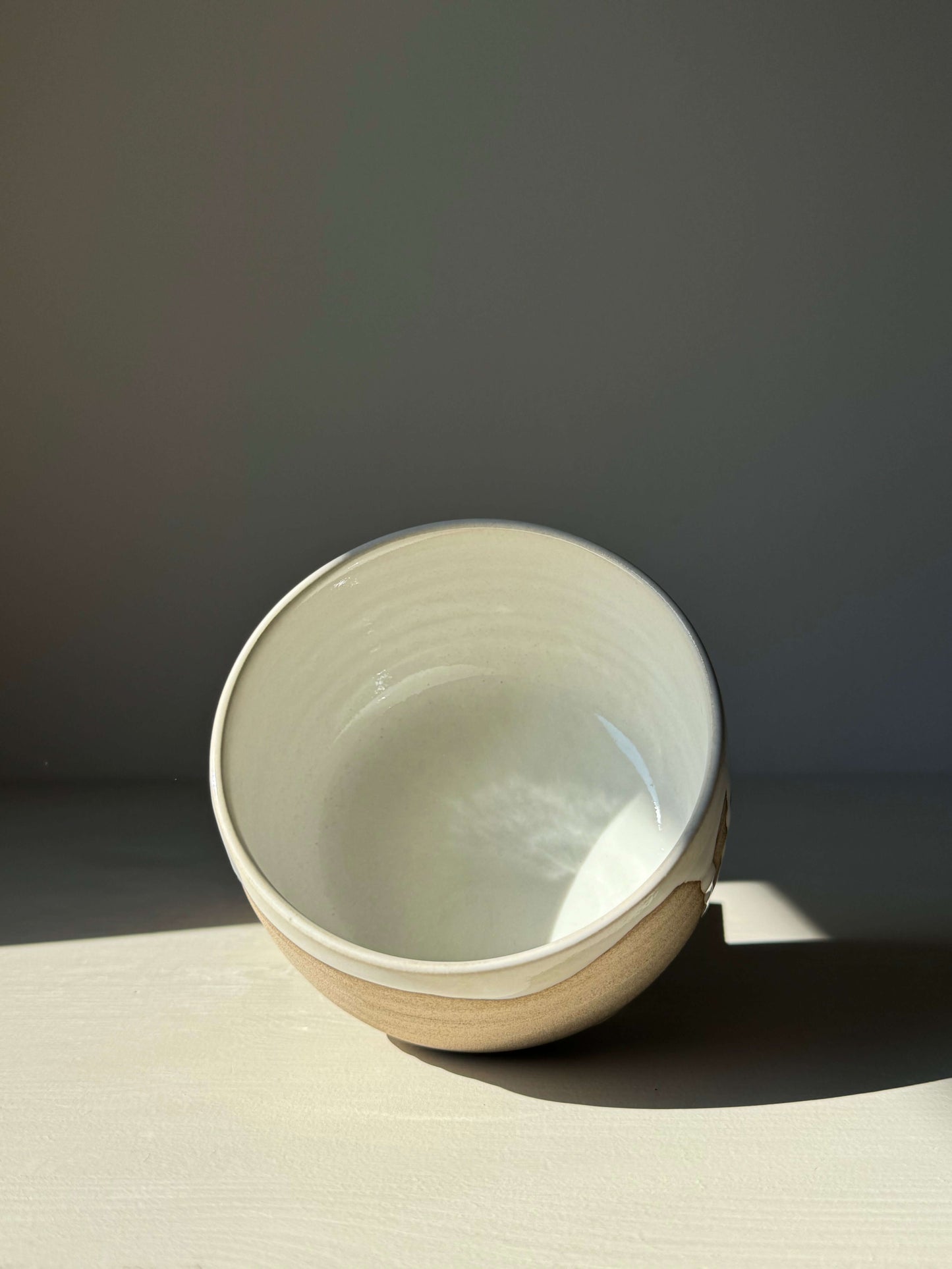 Handmade Matcha bowl from Yuki Series, featuring toffee clay and glossy white glaze, perfect for a calming daily ritual.