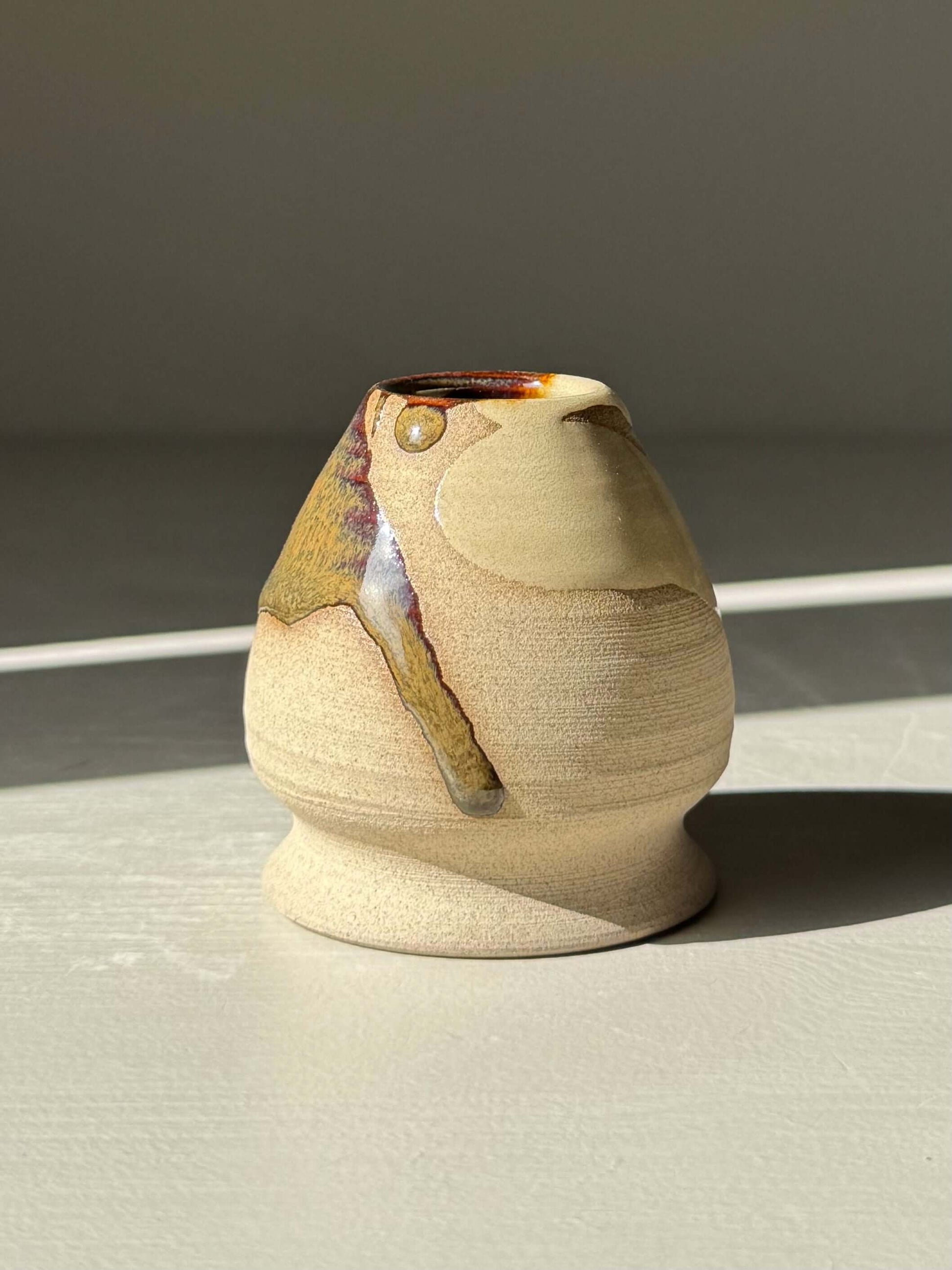 Inyo Matcha Whisk Holder handmade ceramic close up in warm light