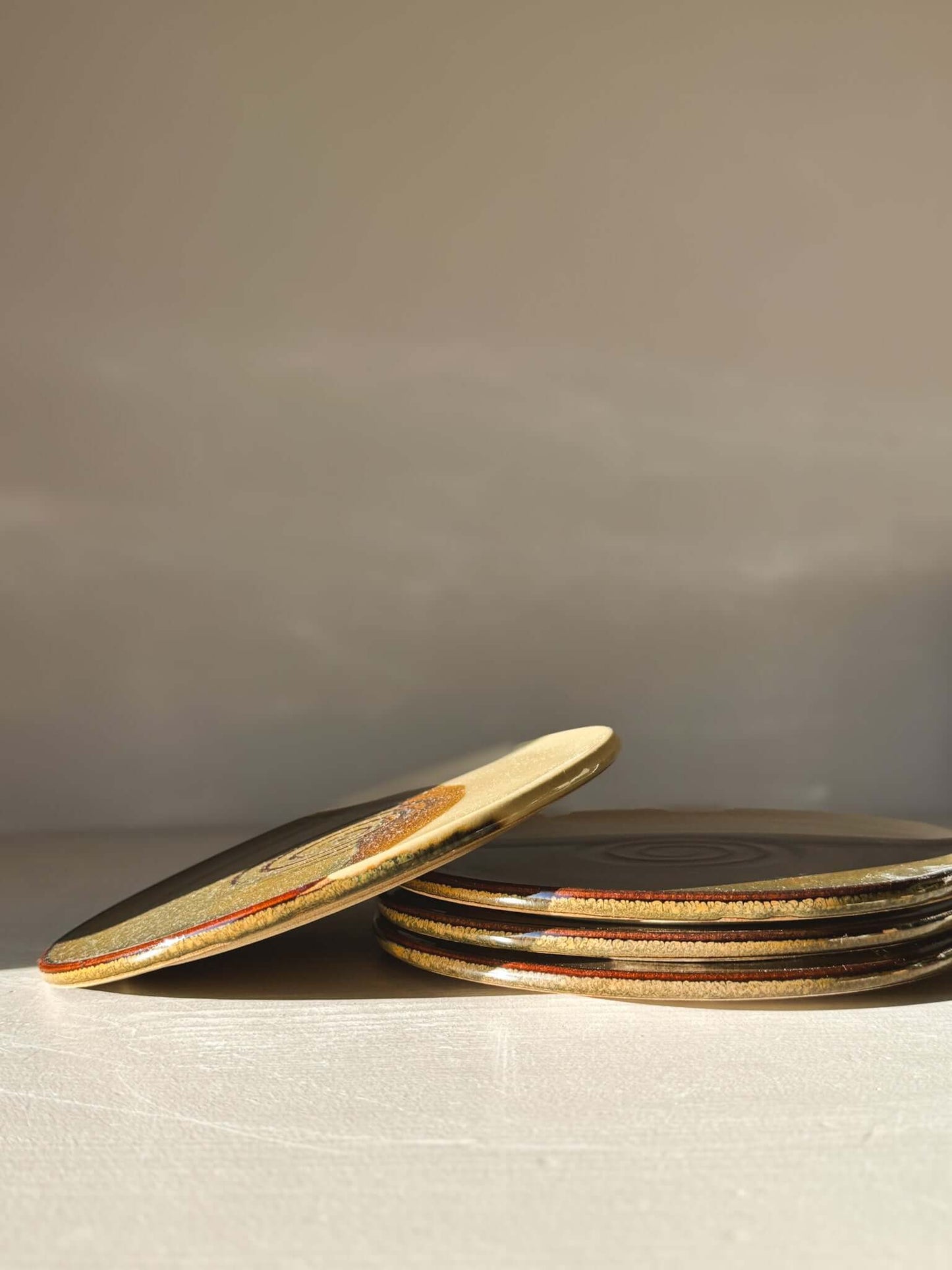 Side Plate – Inyo with contrasting tenmoku and creamy glaze, perfect for everyday meals and morning treats.