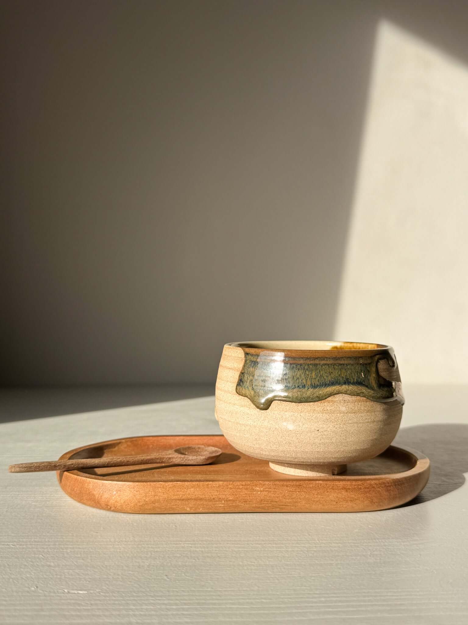 Coffee cups - Inyo handmade ceramic with unique glazing on wooden tray in soft lighting