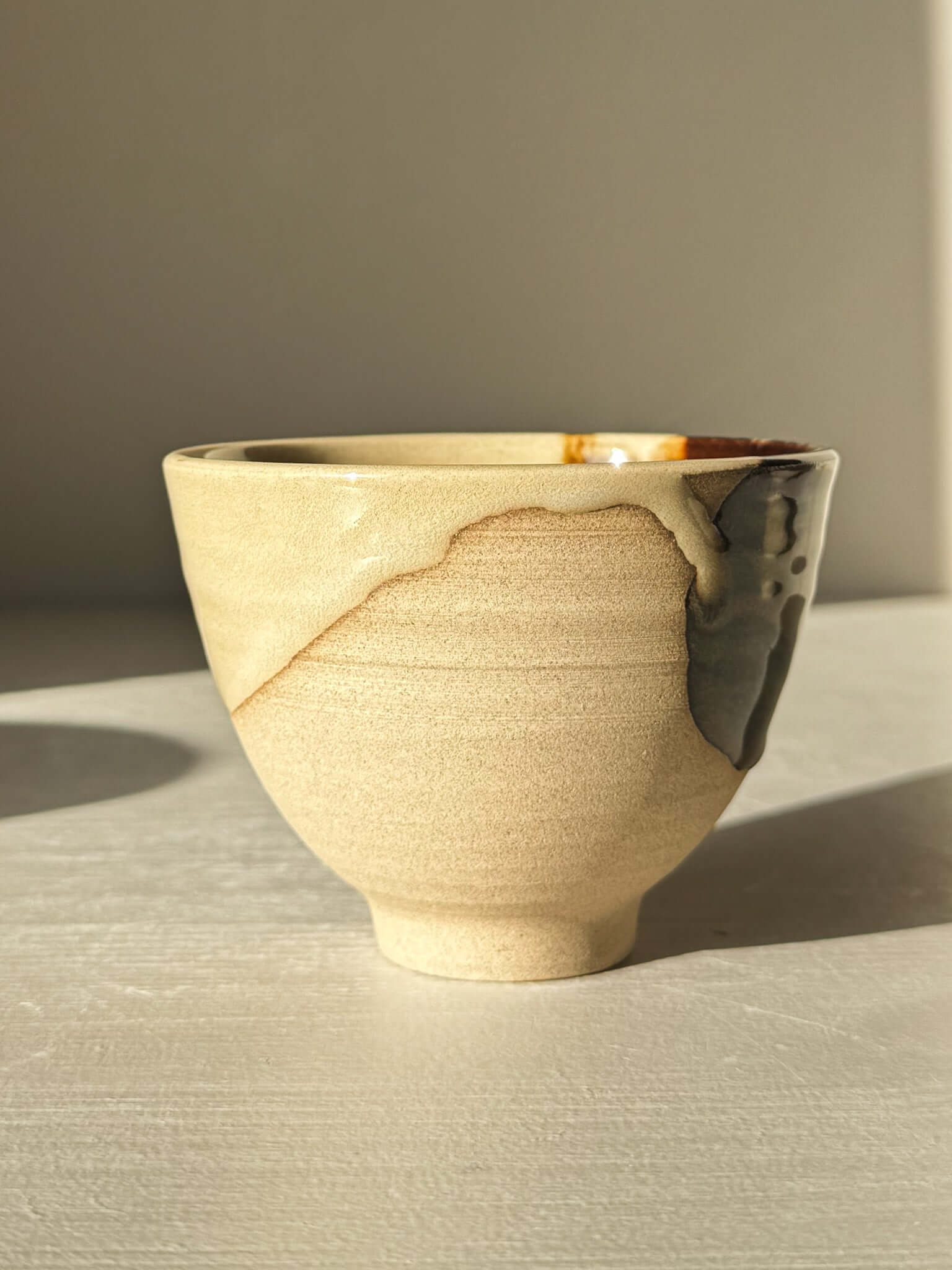 Yunomi Cups - Inyo #01 with soft glaze drips and unique color blends in gold, brown, and blue, classic Japanese tea cup design.