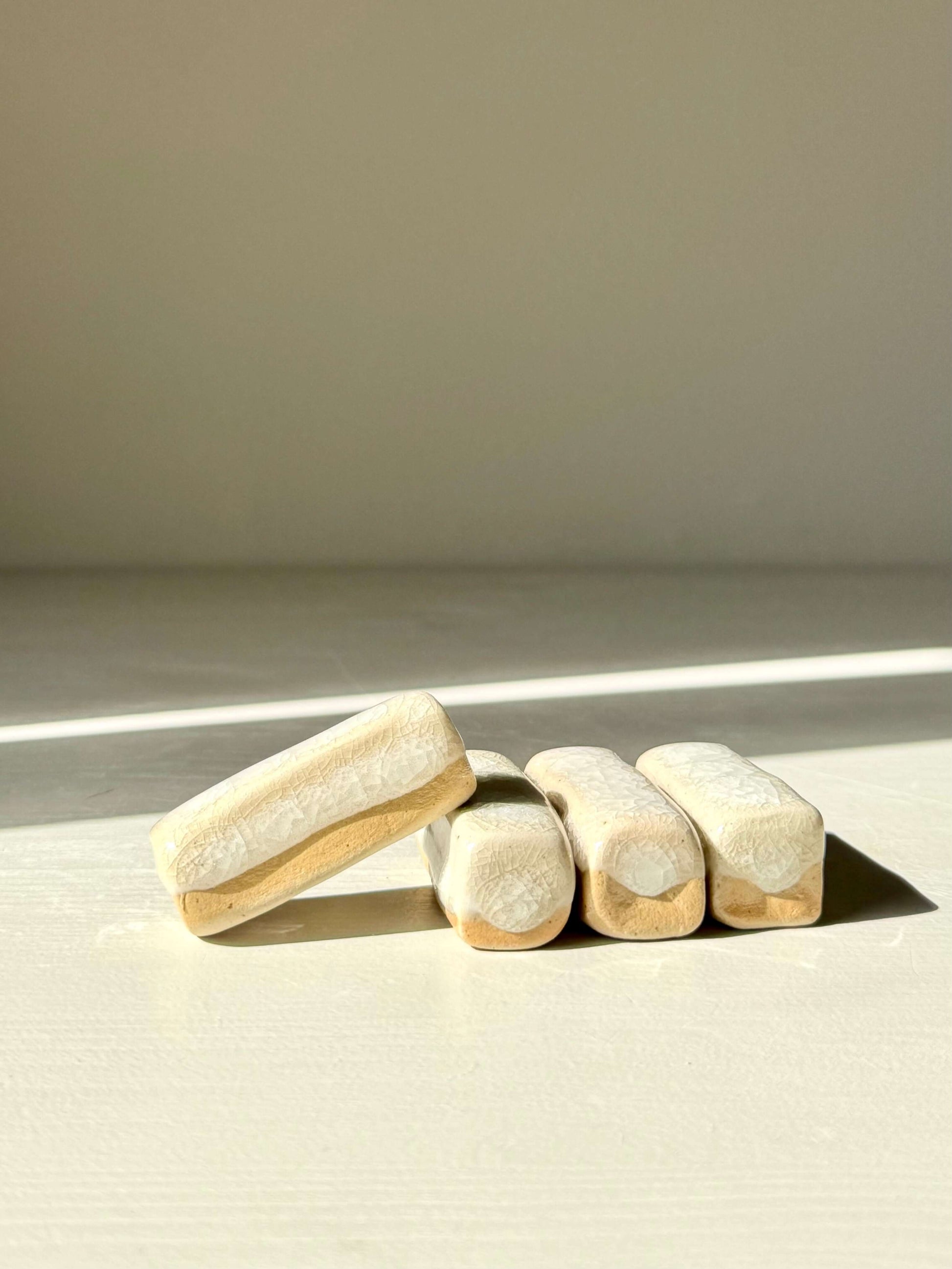 Chopstick/Spoon Rest – Kannyū handmade ceramic with crackle glaze and soft edges, perfect for elegant dining settings.