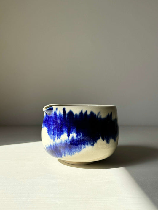 Katakuchi Matcha Bowl with cobalt blue glaze in dynamic patterns from the Gosu Series, featuring a unique spout design.