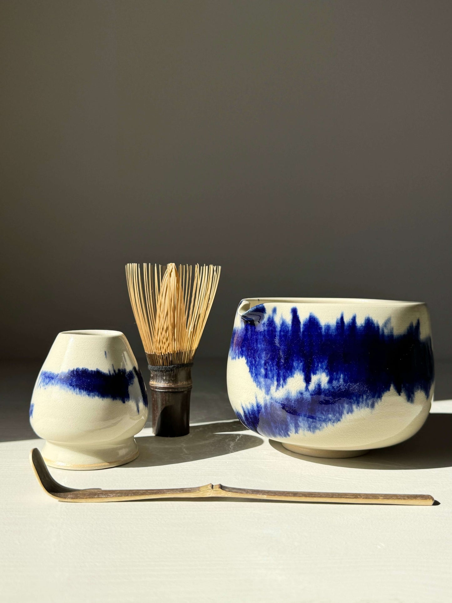 Katakuchi Matcha Bowl with Spout in cobalt blue, part of Gosu Series, featuring traditional Japanese design and dynamic glaze patterns.