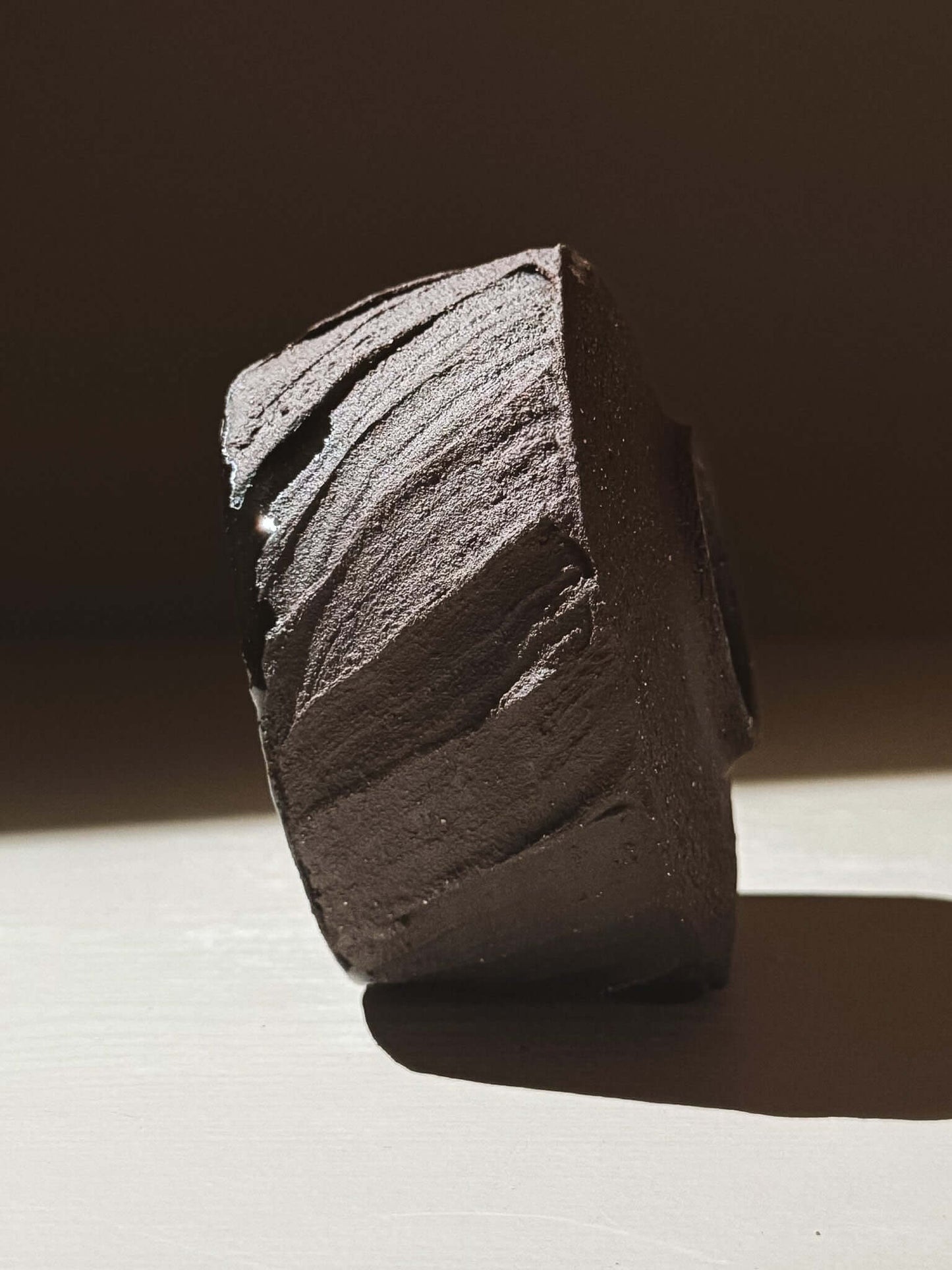 Yunomi Cup - Kuro #02 showcasing its textured dark brown clay and unique earthy design.