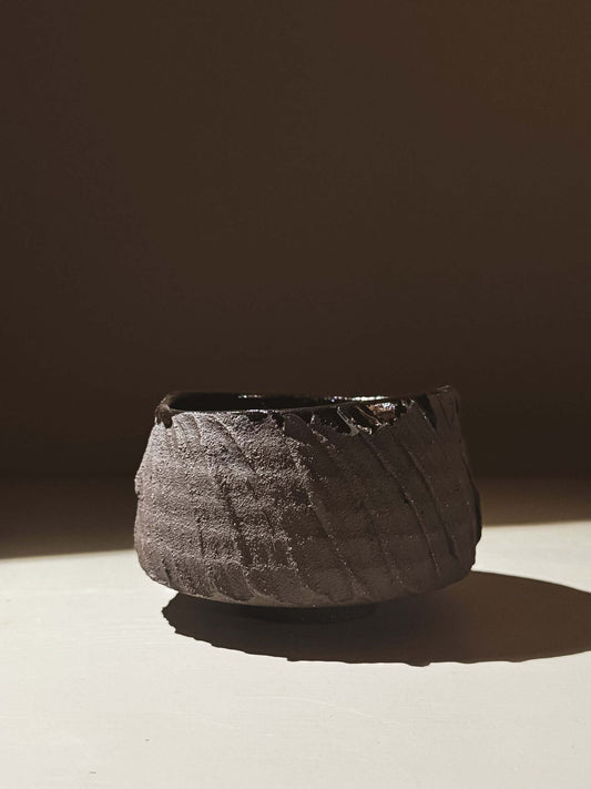 Kuro Matcha Bowl #02 with textured dark brown slip and glossy interior, inspired by volcanic stone and earthy textures.