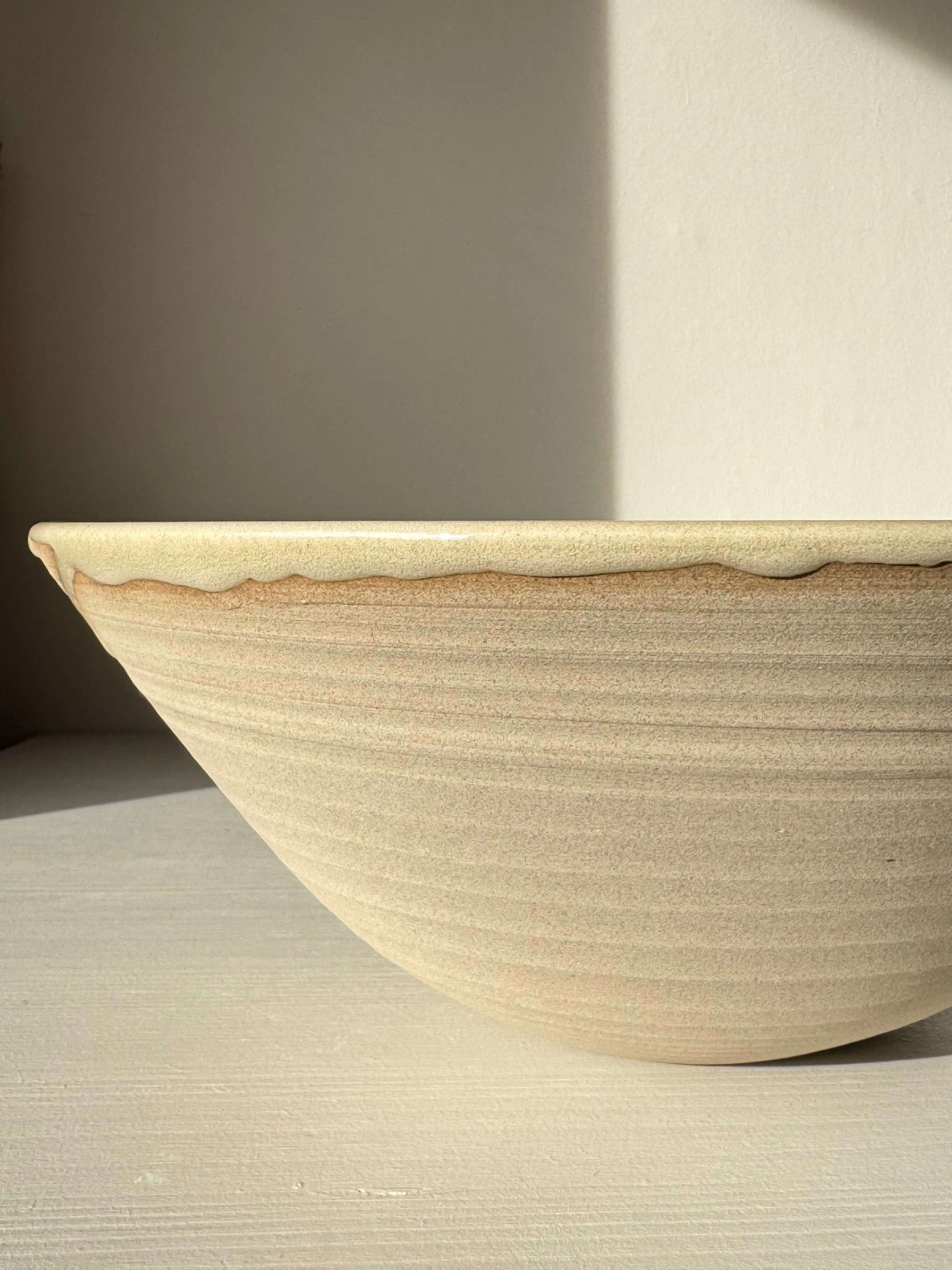 Large Bowl - Inyo #02 handmade ceramic with glossy tenmoku glazes on light surface, perfect for gatherings.