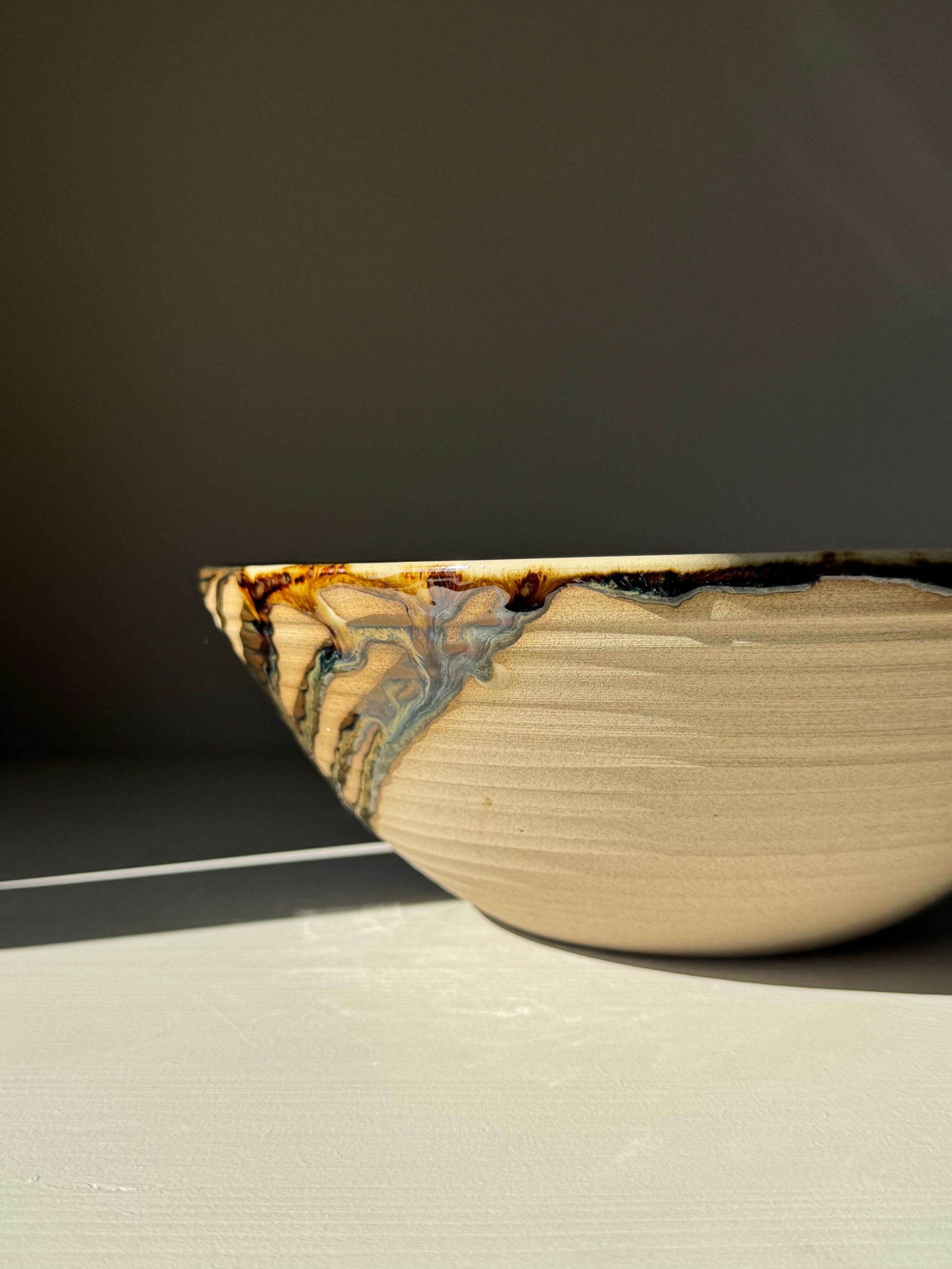 Large Bowl - Inyo #01 handmade ceramic with glossy dark tenmoku and transparent clear glaze, perfect for gatherings and generous servings.