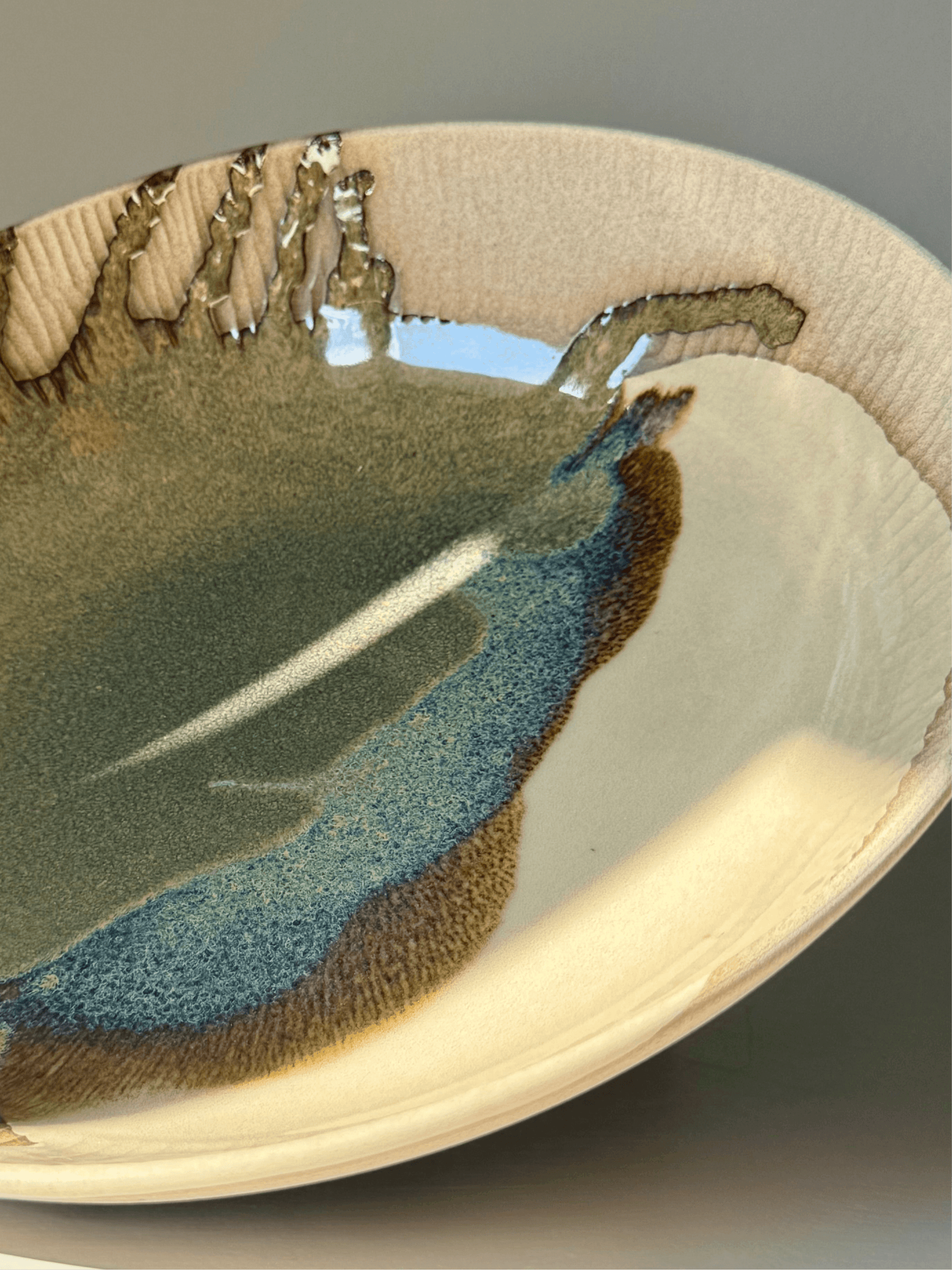 Alt Tag: Large Shallow Bowl - Inyo Series with carved rim and deep tenmoku glaze, handmade ceramic masterpiece.