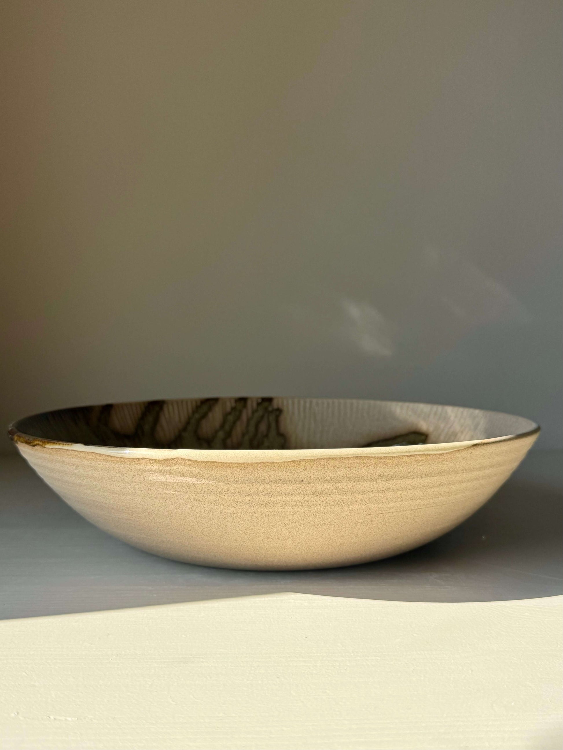 Large Shallow Bowl - Inyo Series handmade ceramic with carved rim and deep tenmoku glaze, measuring 27 cm in diameter.
