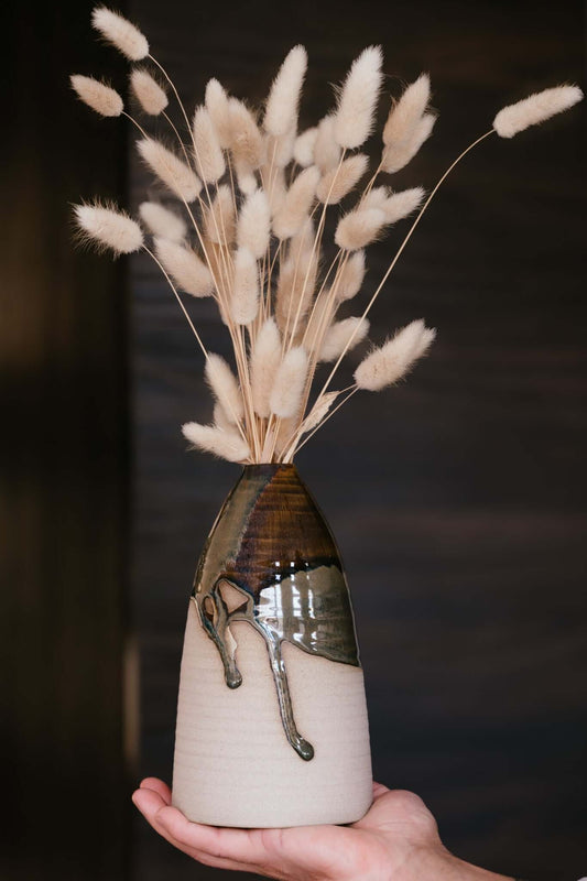 Large Vase – Inyo Series #02 displaying soft lines and gentle taper, with deep browns and mossy greens glaze on warm raw clay, held by hand.