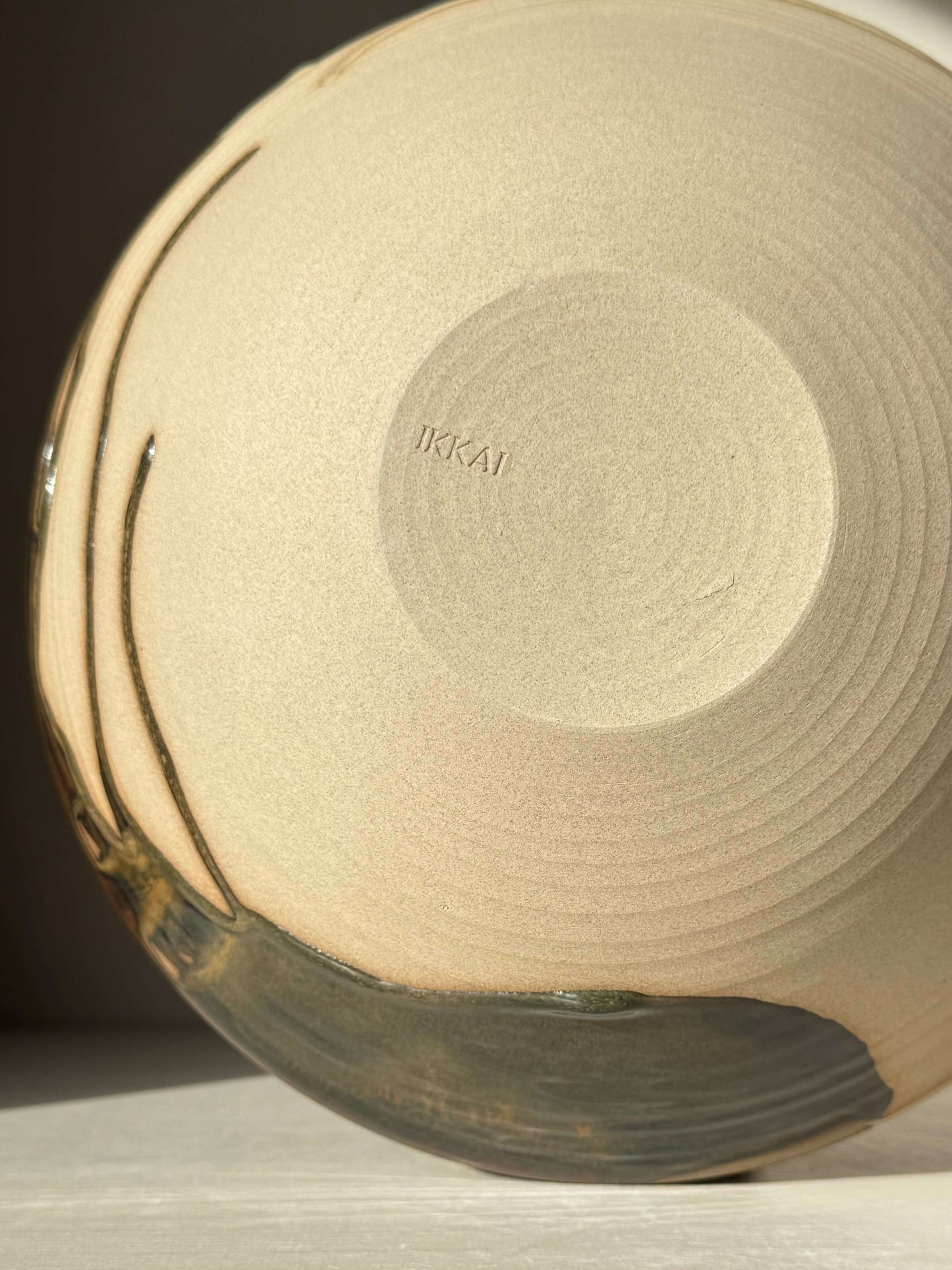 Base of the Large Bowl - Inyo #02 showcasing textured handmade ceramic design with contrasting tenmoku and clear glazes