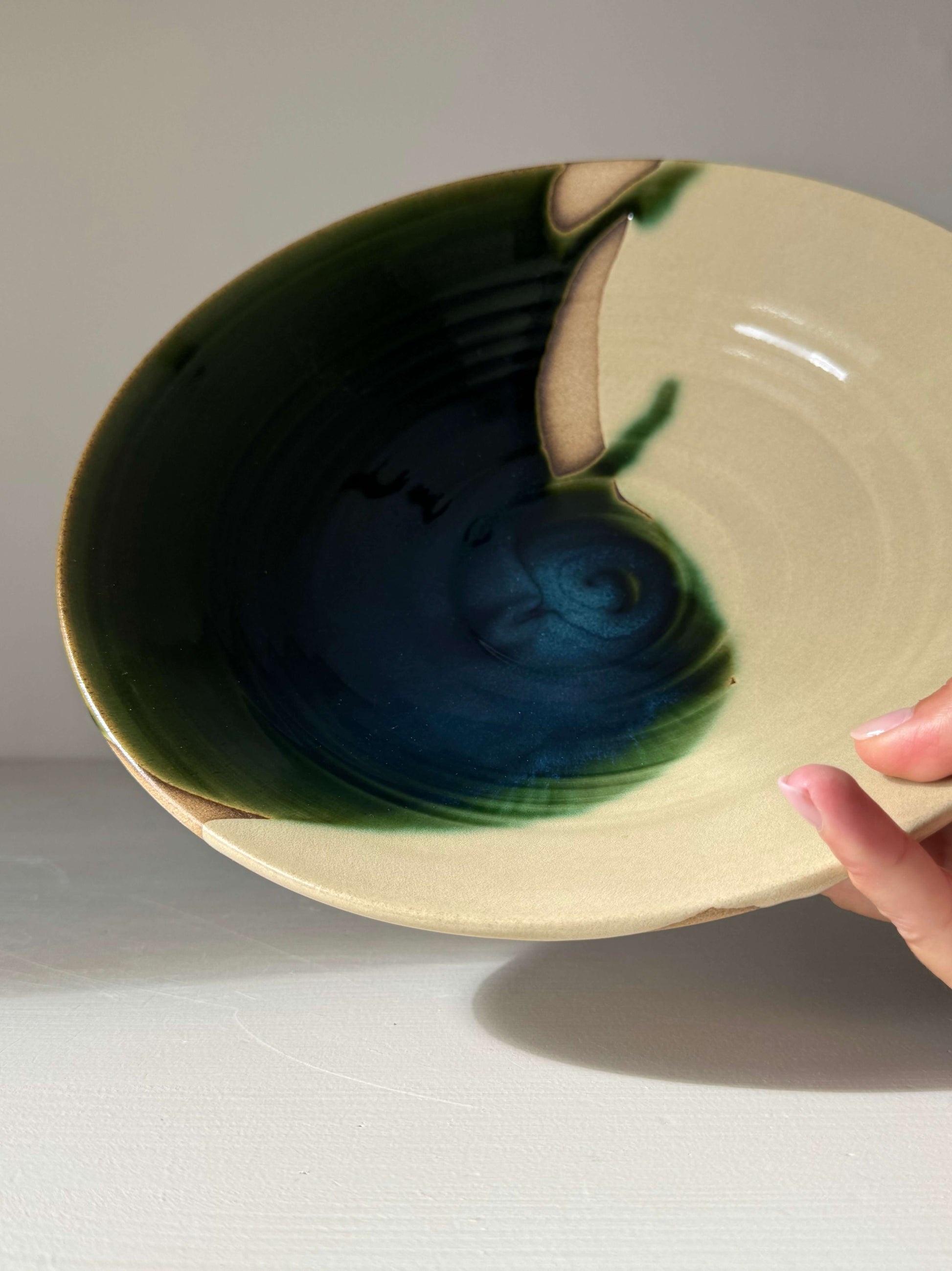 Handmade ceramic Large Shallow Bowl - Mori Series with green flowing glaze, ideal for shared meals or decor.