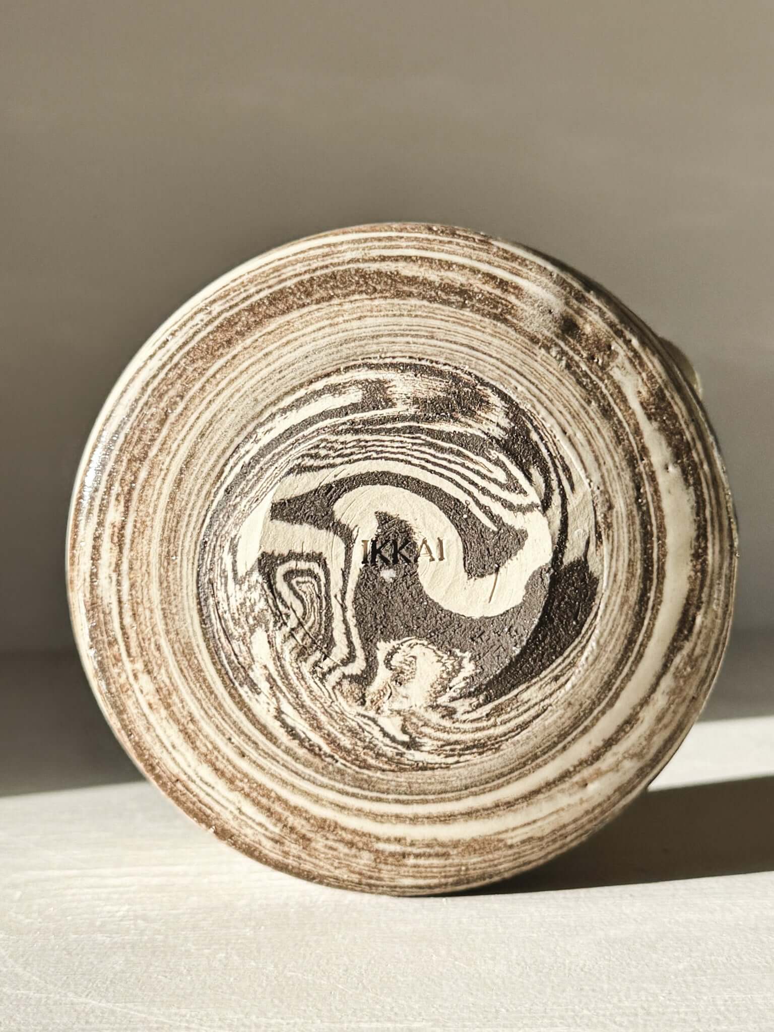 Bottom view of Matcha Bowl Spout - Marbled #01 with natural clay swirls