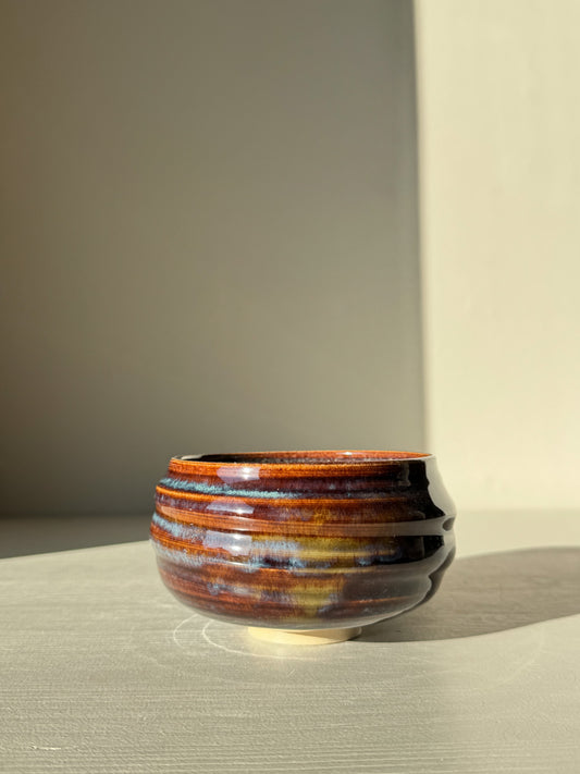 Matcha Bowl - Glossy Blue #02 with earthy tones and flowing blues, handcrafted with unique texture and raised foot. Approx. 7.5cm height x 10.5cm diameter.