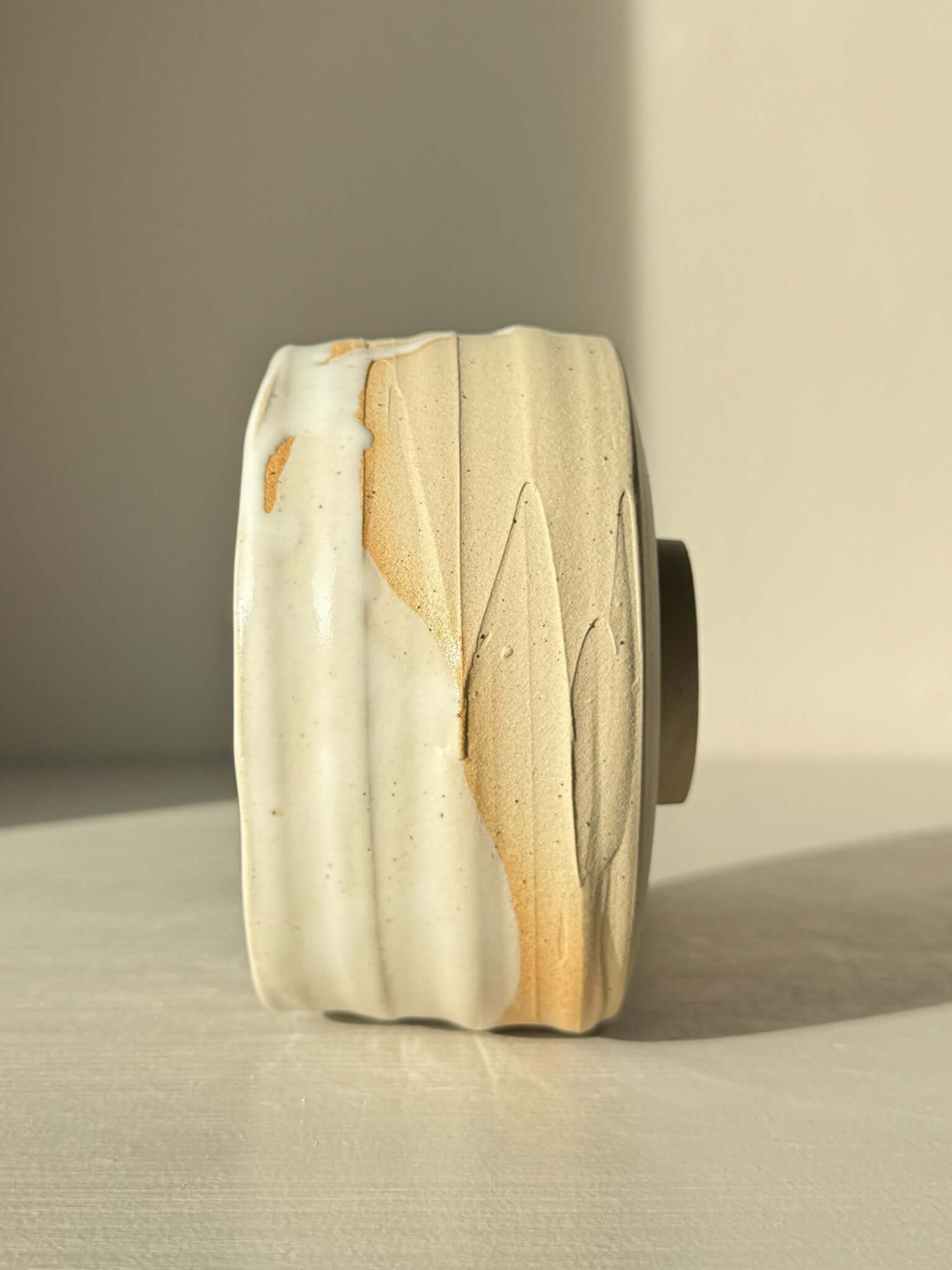 Side view of Matcha Bowl – Glossy White #05 with speckled stoneware and white glaze showing texture and color contrast.
