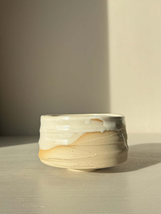 Matcha Bowl – Glossy White #05 with speckled stoneware clay and glossy white glaze on a neutral background.