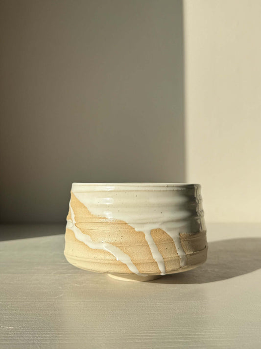 Matcha Bowl – Glossy White #03 made with speckled stoneware clay, showcasing a bold silhouette and glossy white glaze with natural drips.