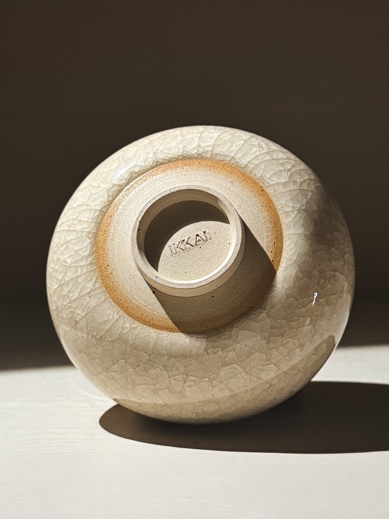 Matcha Bowl - Kannyū  #14, a soft rounded bowl with a clear crackle glaze, showcasing a gentle flower-like shape.