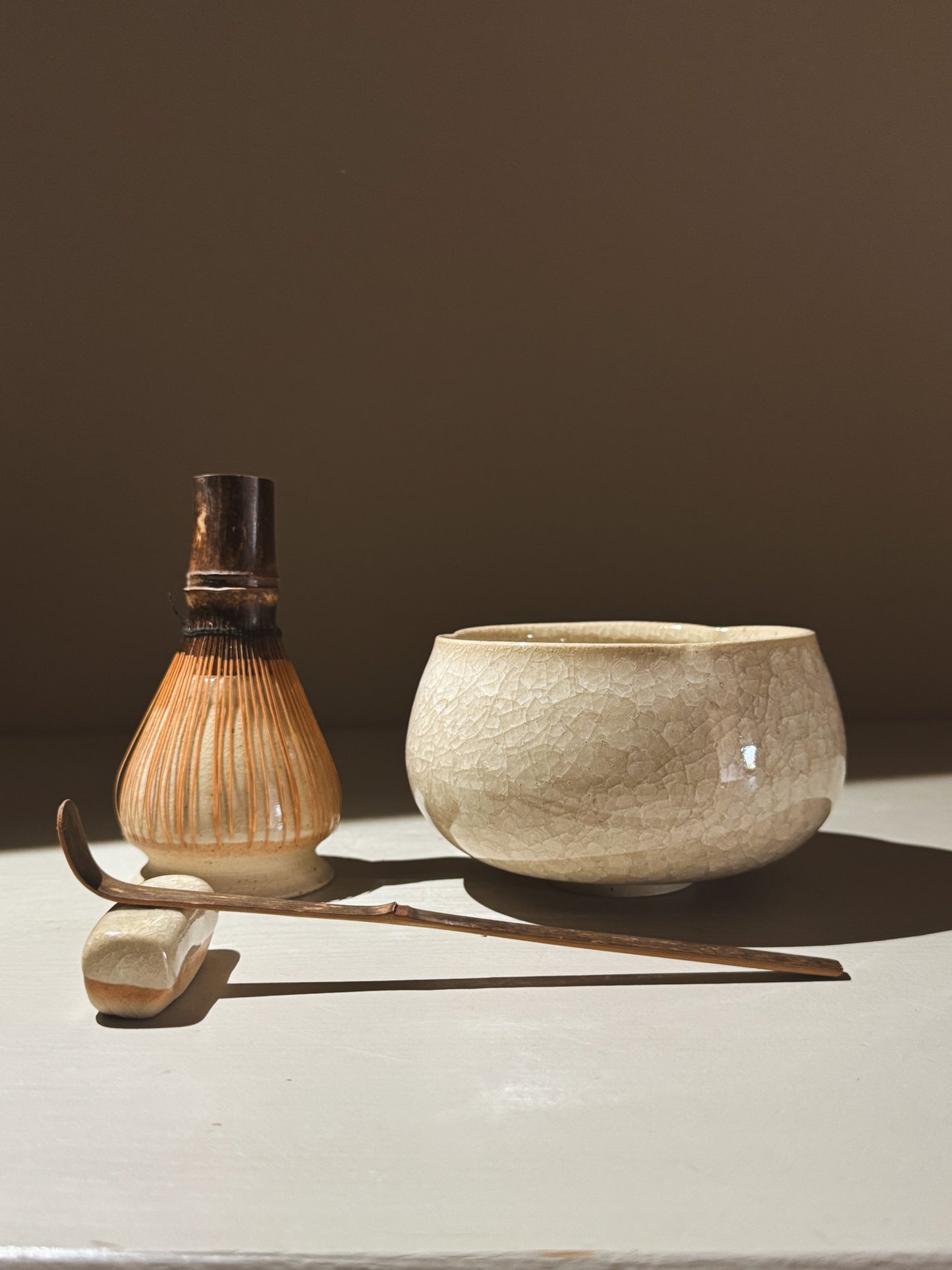 Matcha Bowl - Kannyū  #14 with bamboo whisk and scoop, showcasing its elegant crackle glaze.