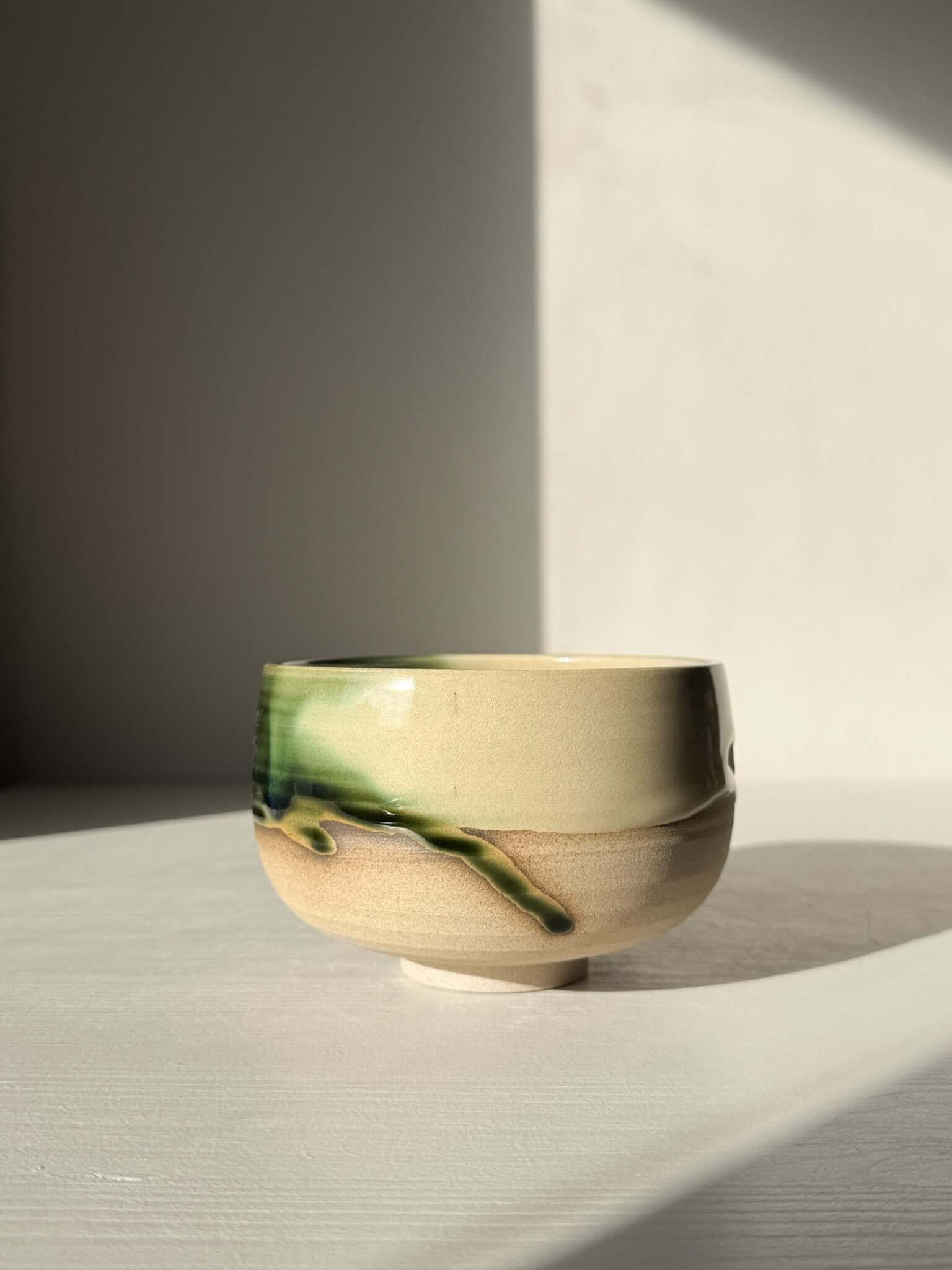 Handmade ceramic Matcha Bowl – Mori #01 with green and brown glazes, showcasing the Mori Series' natural stoneware elegance.