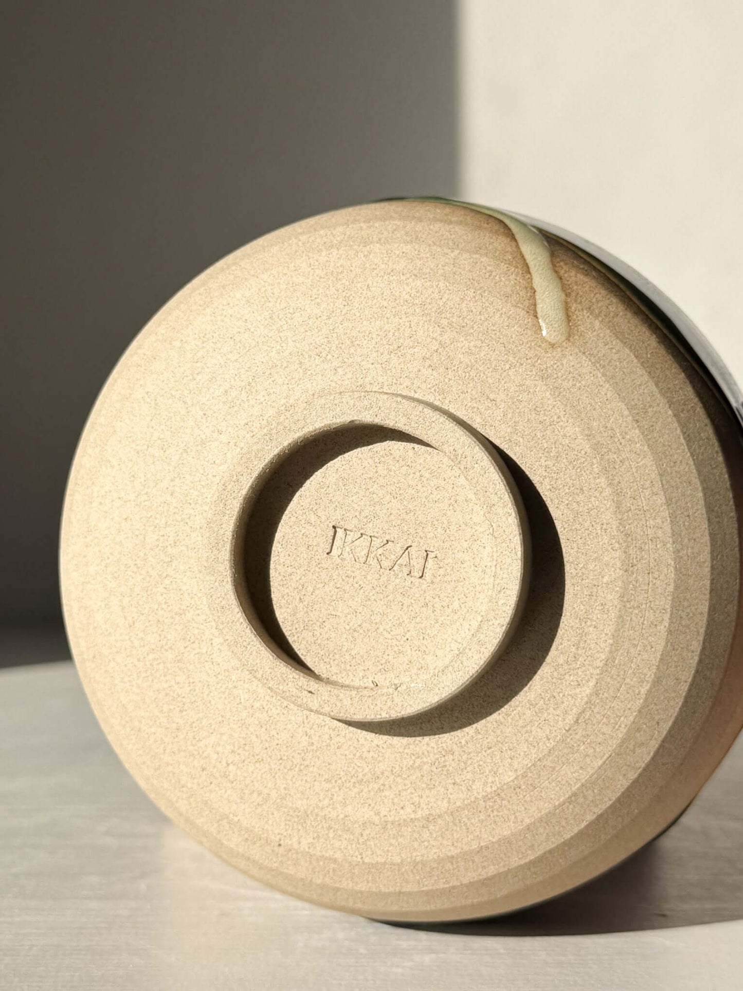Base of handmade ceramic Matcha Bowl – Mori #04, showcasing natural stoneware with glaze detail, part of the Mori Series.