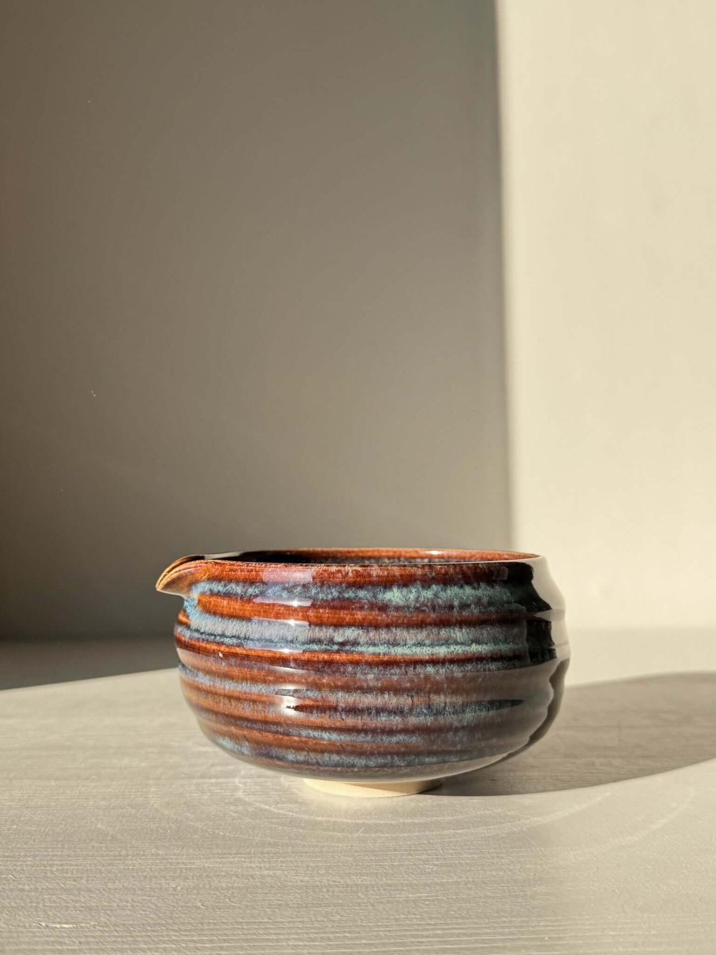 Matcha Bowl Spout - Glossy Blue #01 with earthy tones and pouring spout, handmade chawan with unique flowing blue patterns.