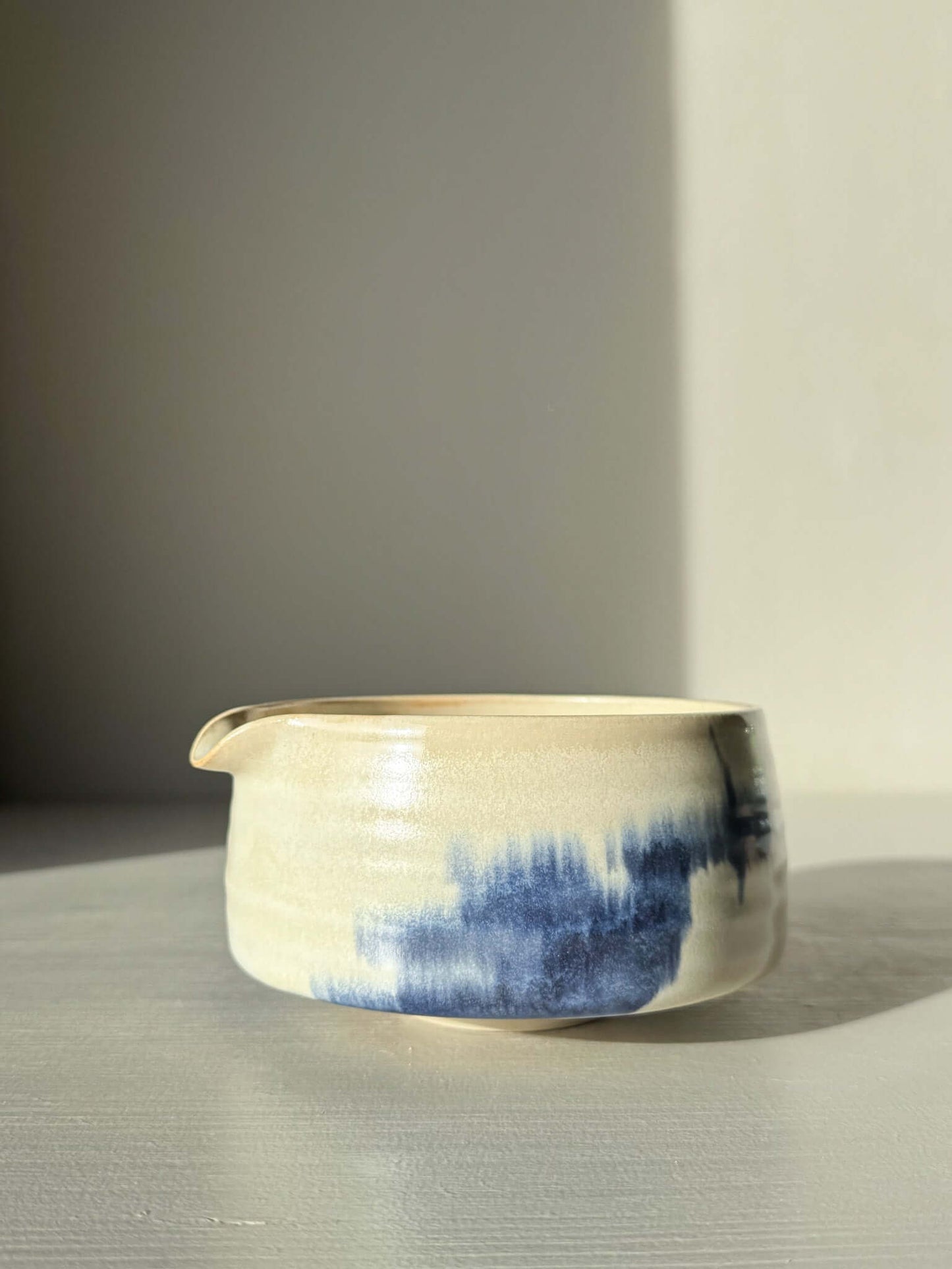 Matcha bowl Spout - Moonstone & Blue #01 with hand-splashed cobalt glaze and moonstone layer, creating a calm and foggy look.