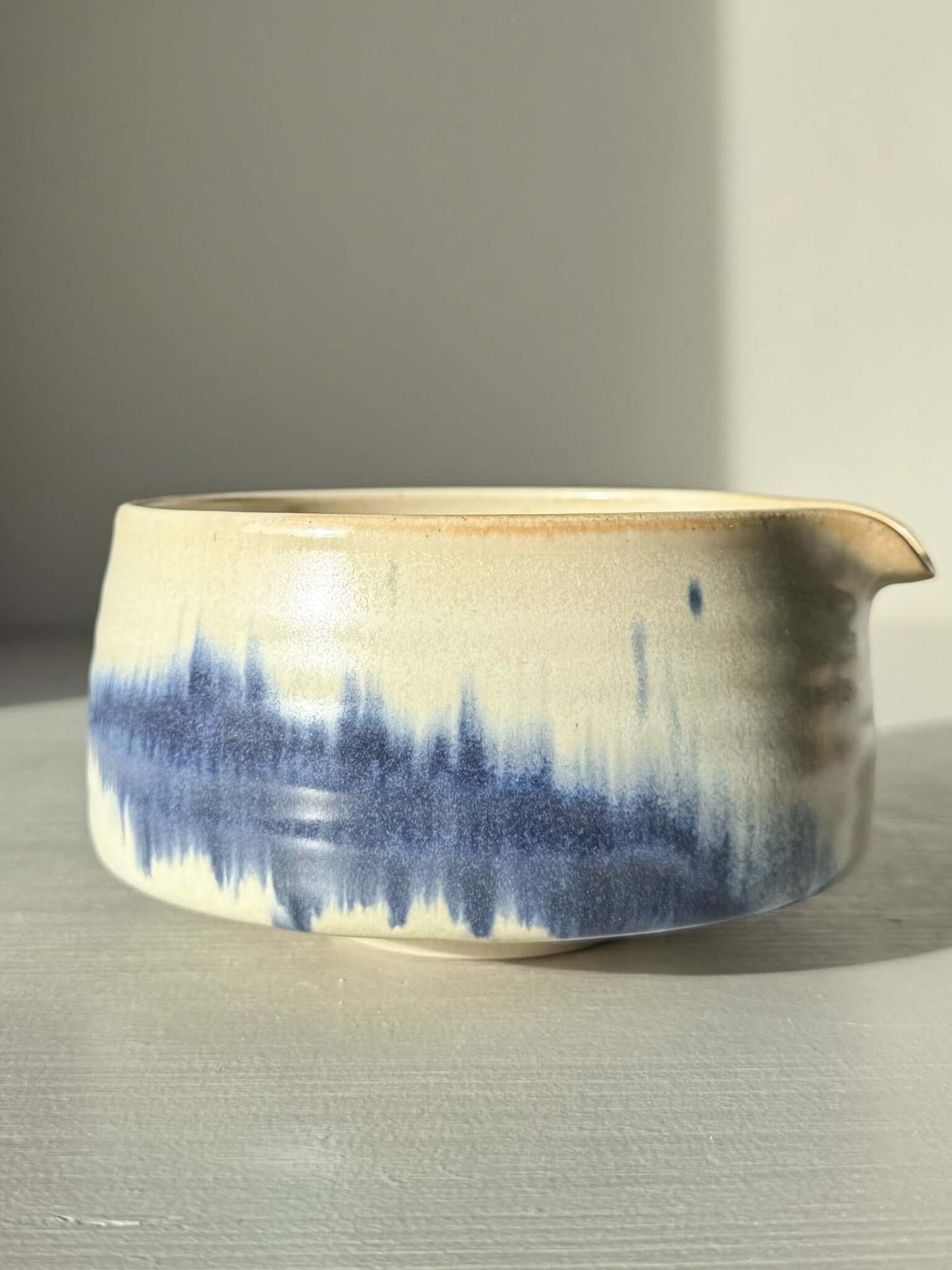 Matcha bowl Spout - Moonstone & Blue #01 with hand-splashed cobalt glaze, showcasing a tranquil misty ink effect.