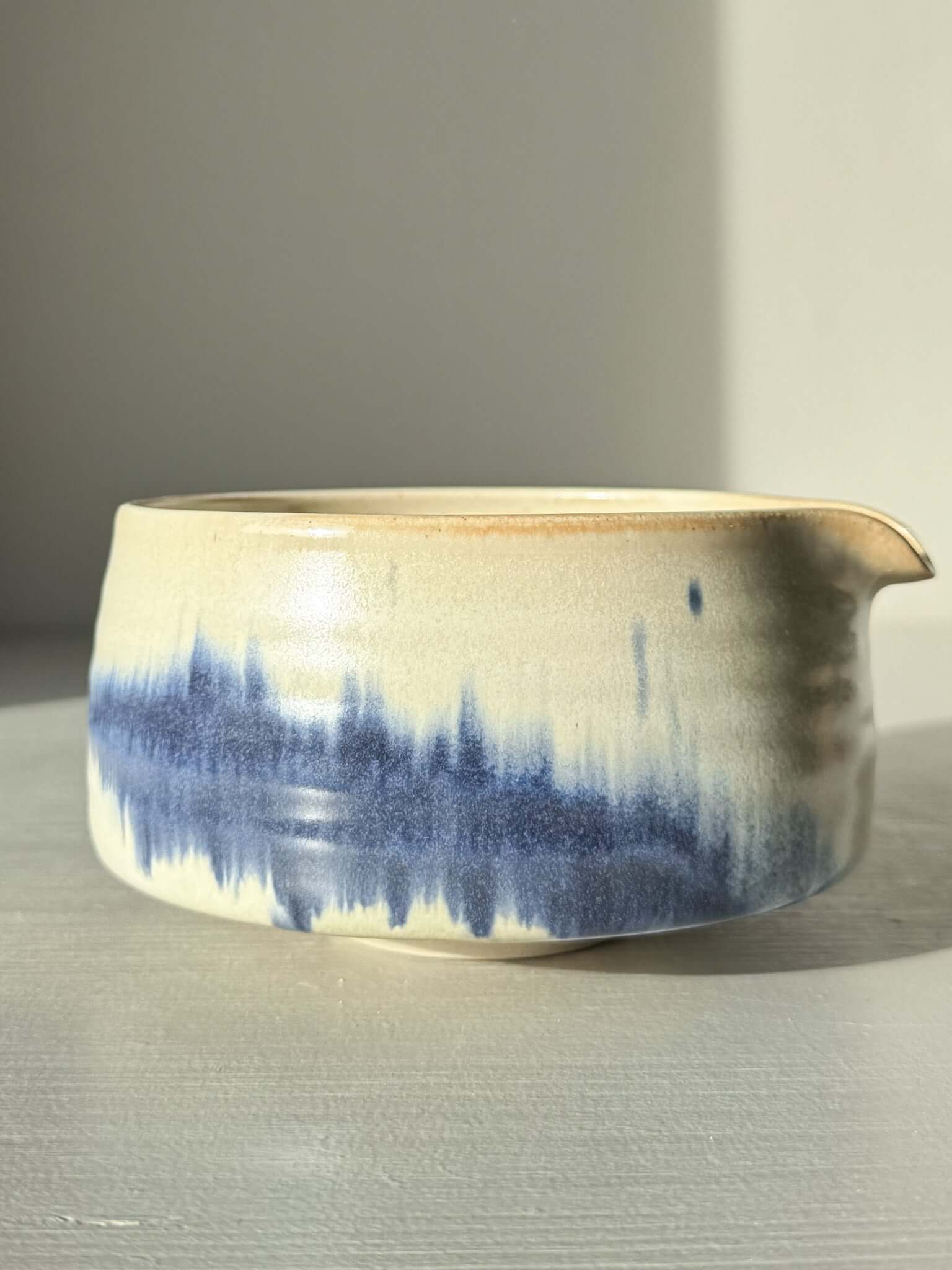 Matcha bowl Spout - Moonstone & Blue #01 with hand-splashed cobalt glaze, showcasing a tranquil misty ink effect.