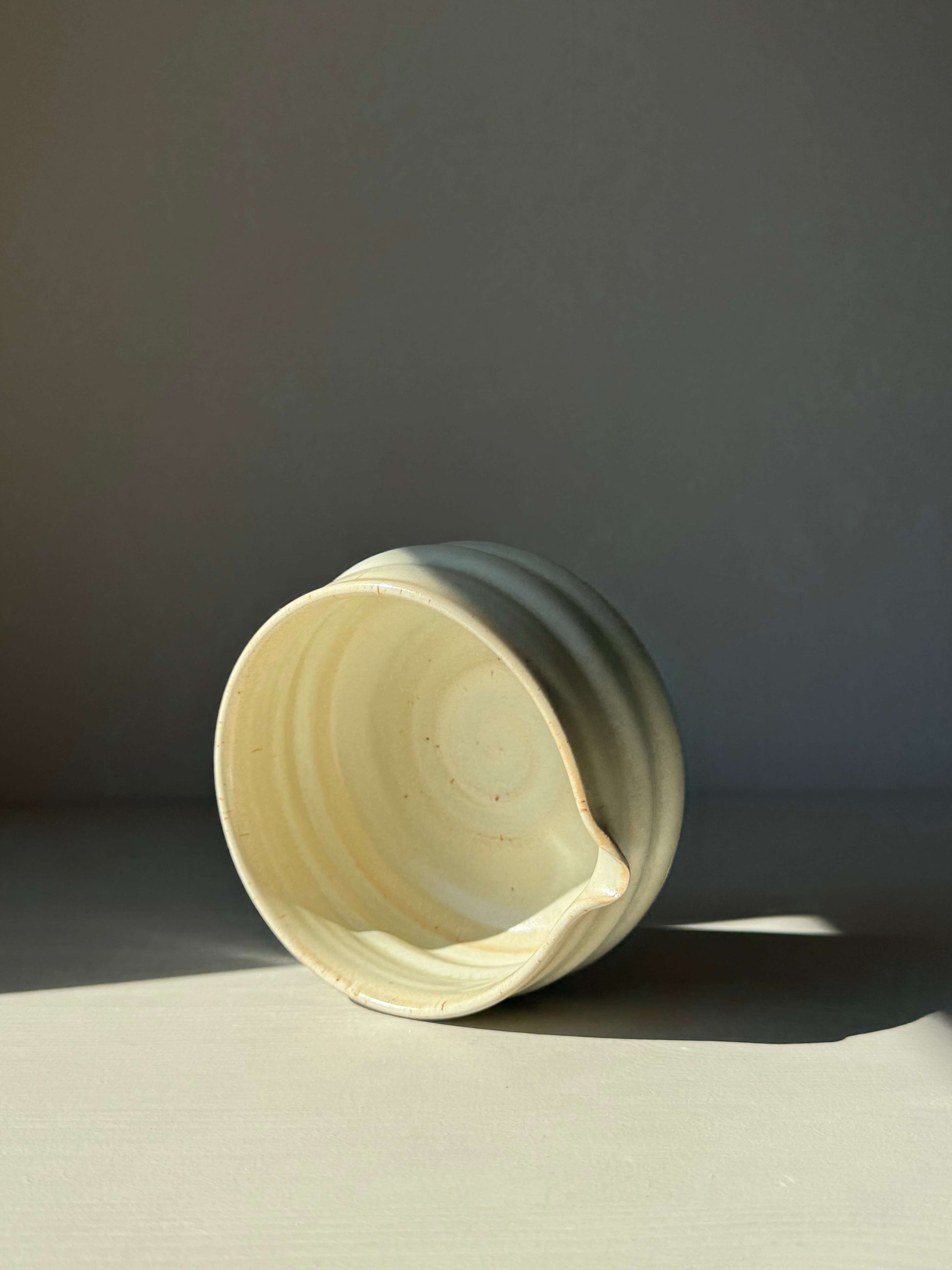 Moonstone Glaze matcha bowl with spout, featuring a ridged design perfect for whisking, shown in soft natural light.