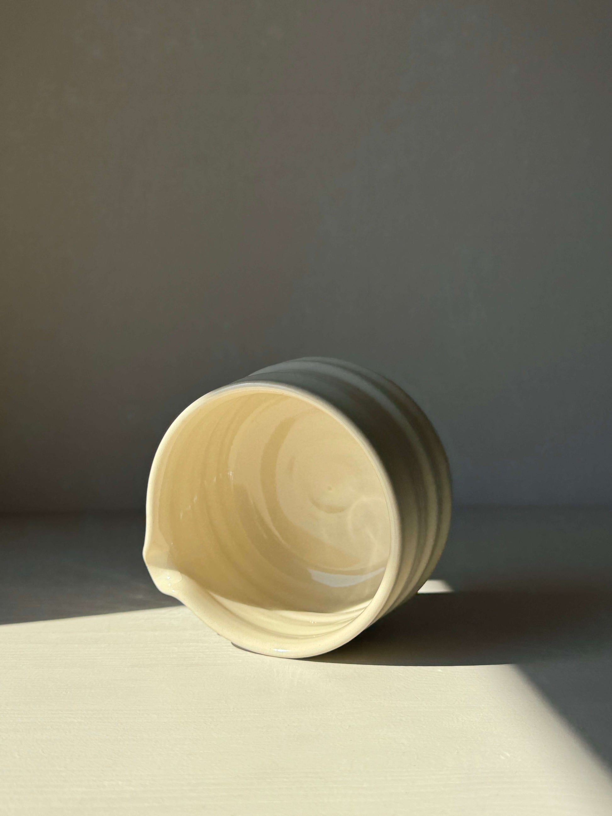 Matcha bowl with spout, featuring clear glaze finish and natural clay texture, in signature design. Size: 7.5cm height, 11cm diameter.