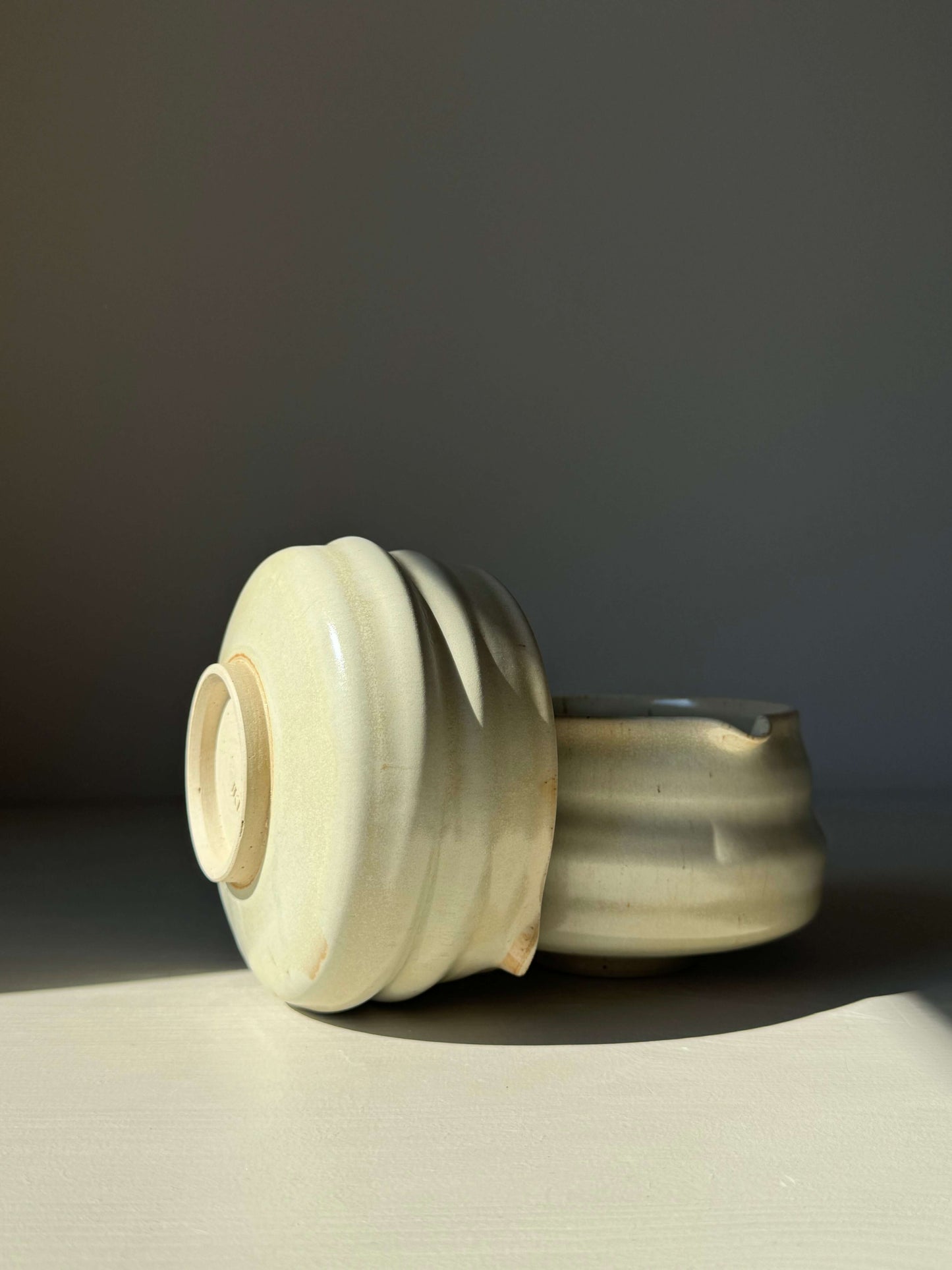 Handcrafted matcha bowl with spout in Moonstone Glaze, featuring a ridged design, ideal for whisking tea, catching light beautifully.
