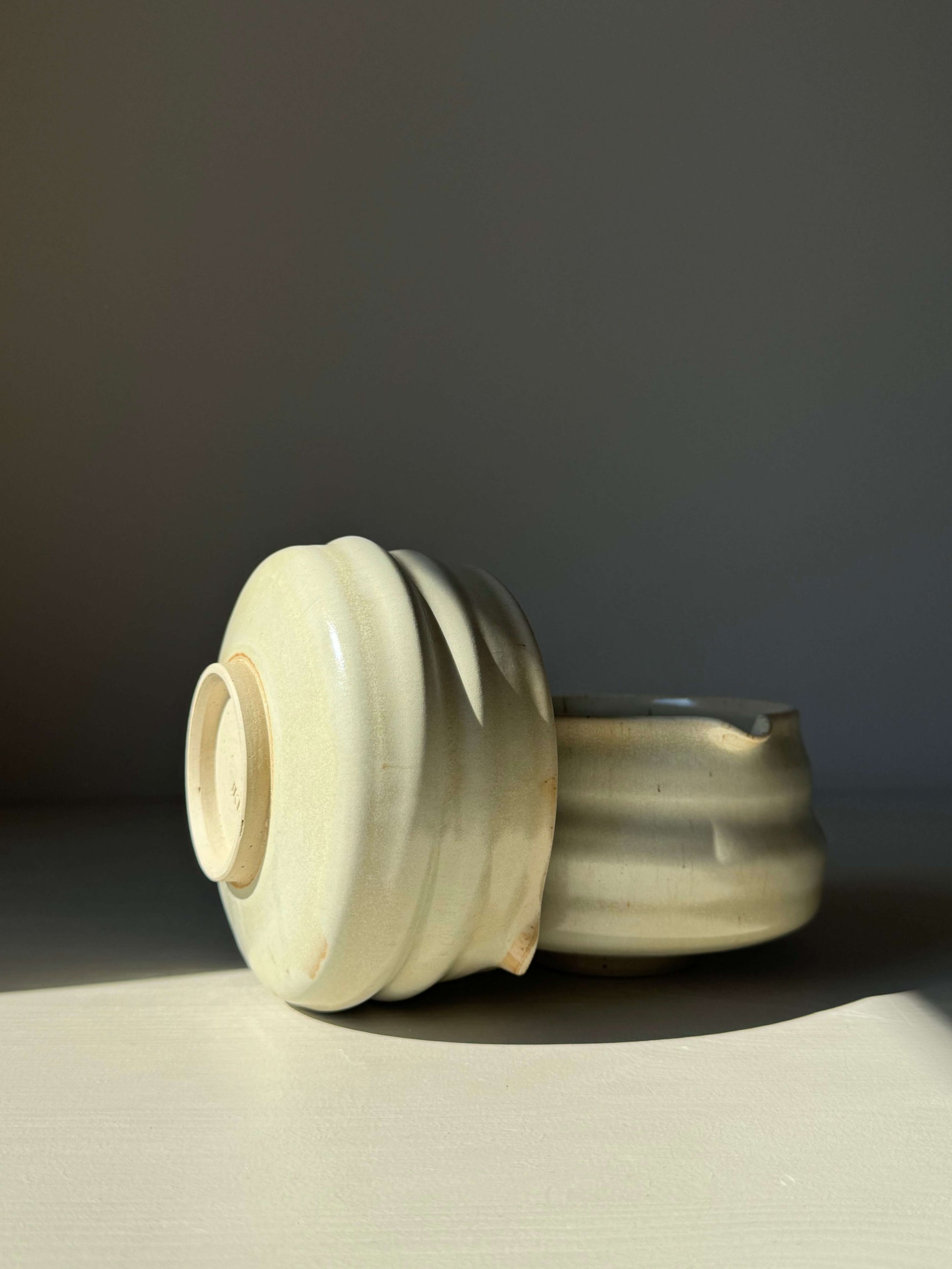 Handcrafted matcha bowl with spout in Moonstone Glaze, featuring a ridged design, ideal for whisking tea, catching light beautifully.