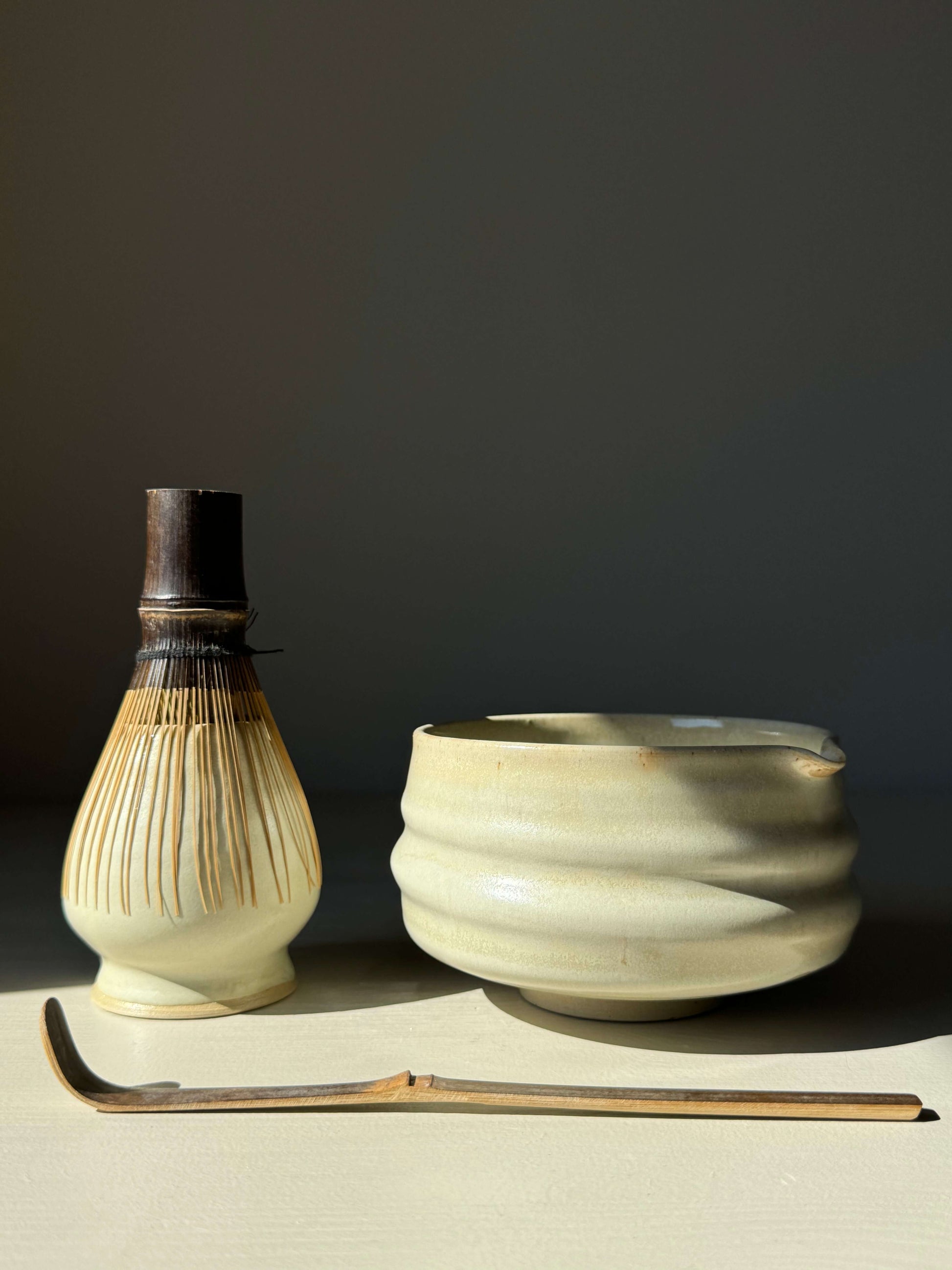 Matcha bowl with spout in Moonstone Glaze, accompanied by a bamboo whisk and scoop, showcasing classic ridged design perfect for whisking.