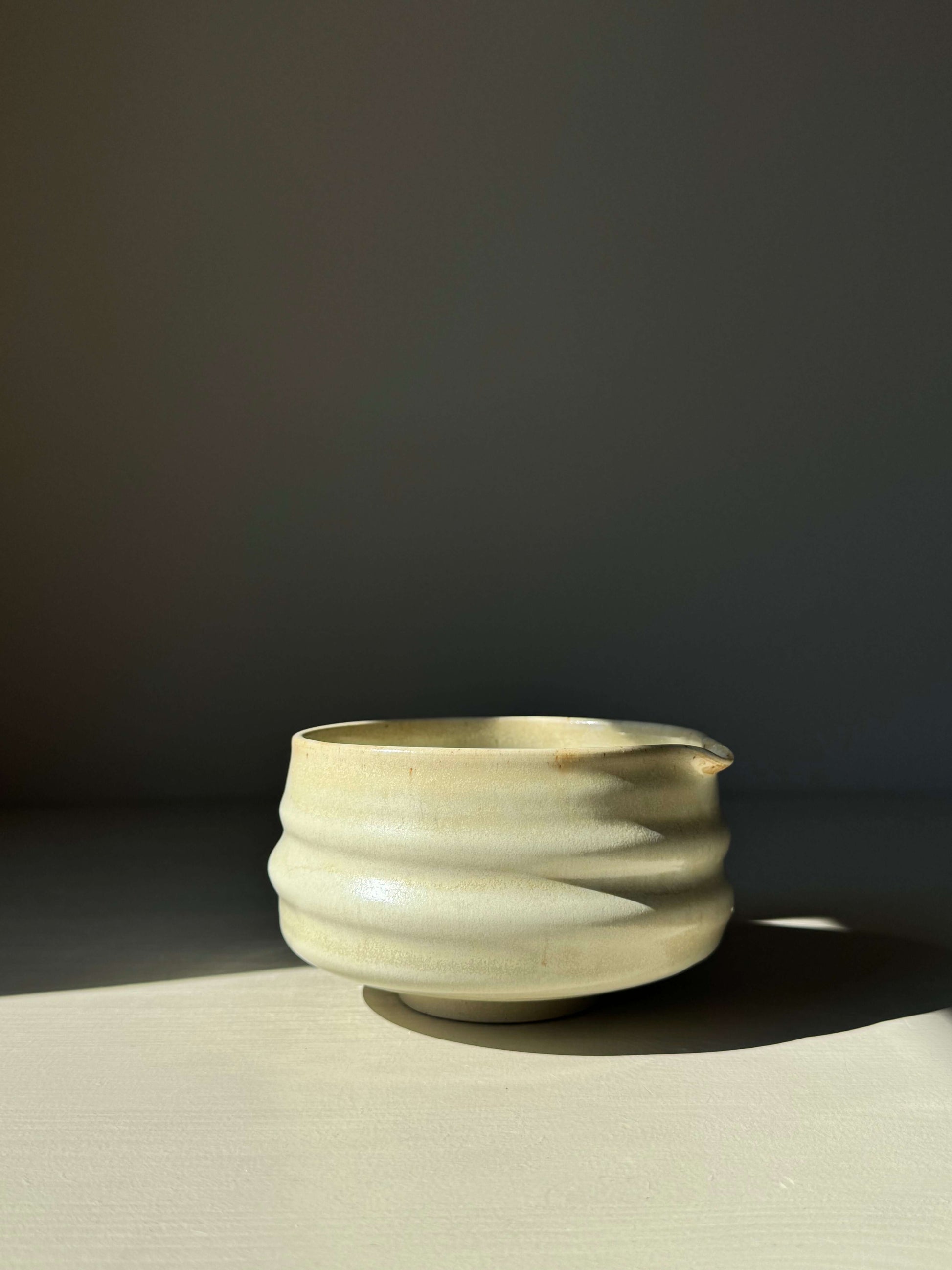 Matcha Bowl with Spout in Moonstone Glaze, ridged design, ideal for whisking tea, capturing light with silky finish.