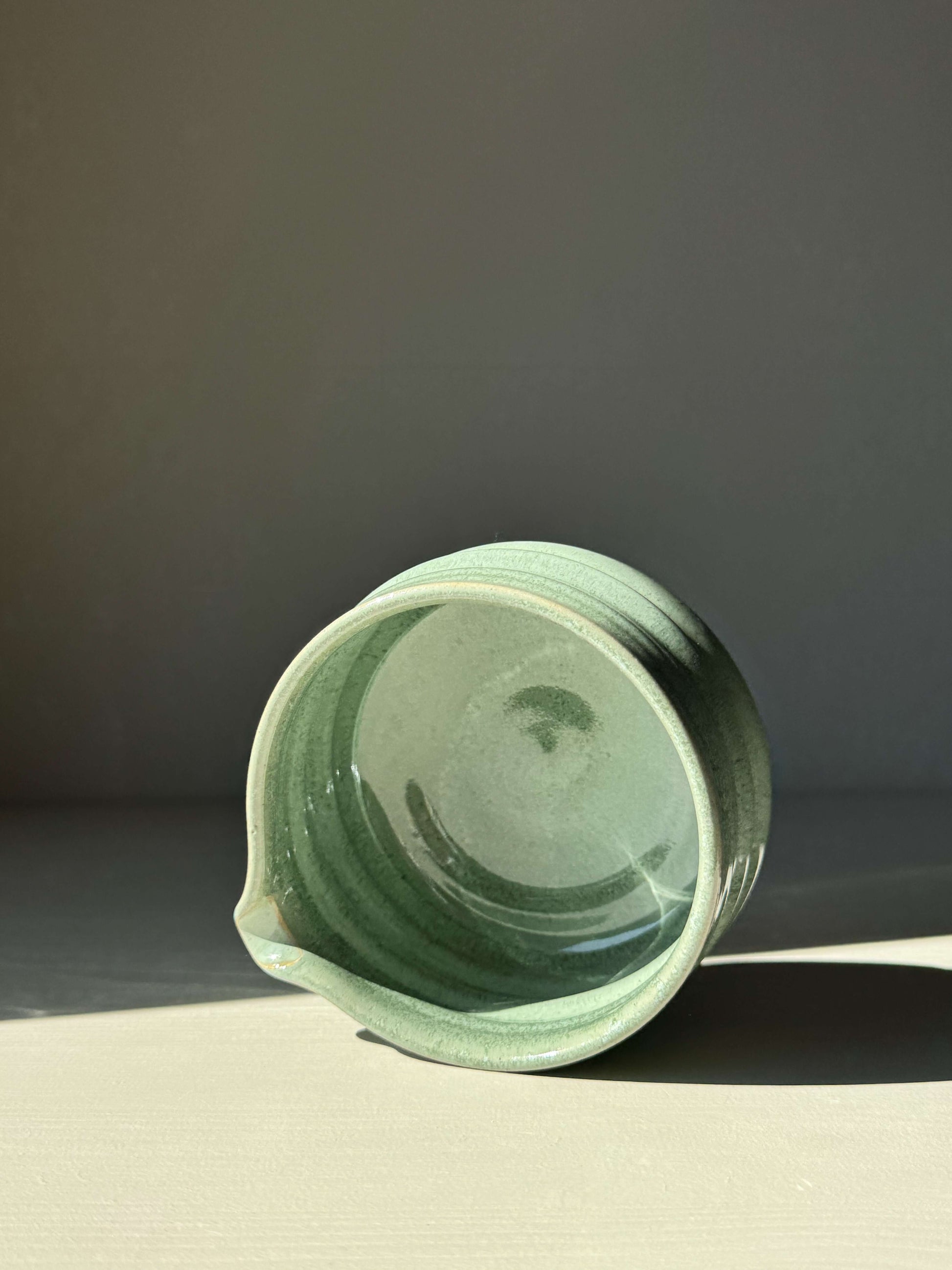 Matcha bowl with spout in sage glaze, displaying ridged design and glossy finish for easy whisking, perfect for tea ceremonies.