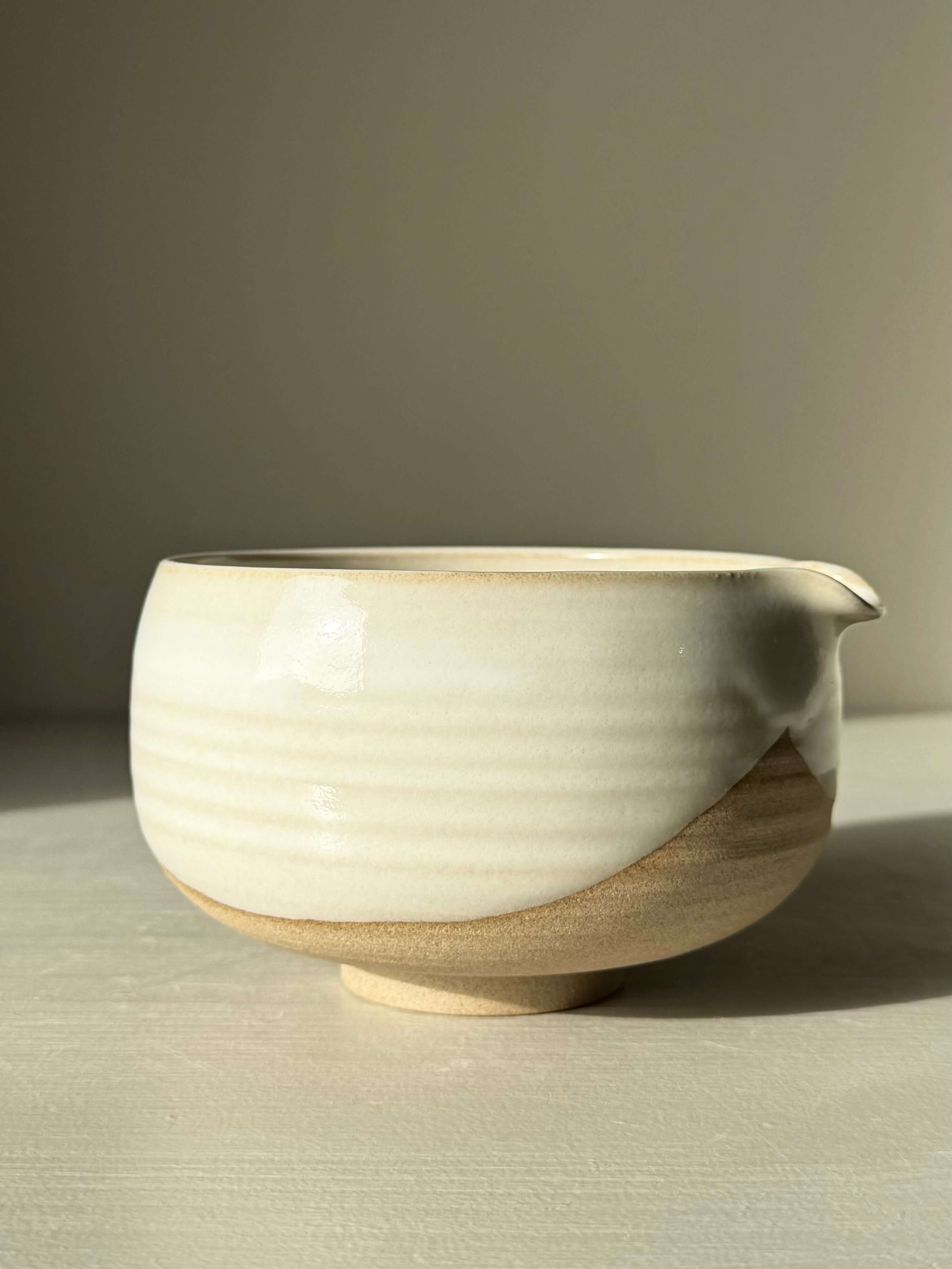 Handmade ceramic Matcha Bowl with Spout – Yuki #03, featuring toffee clay and glossy white glaze, perfect for rituals and grounding.