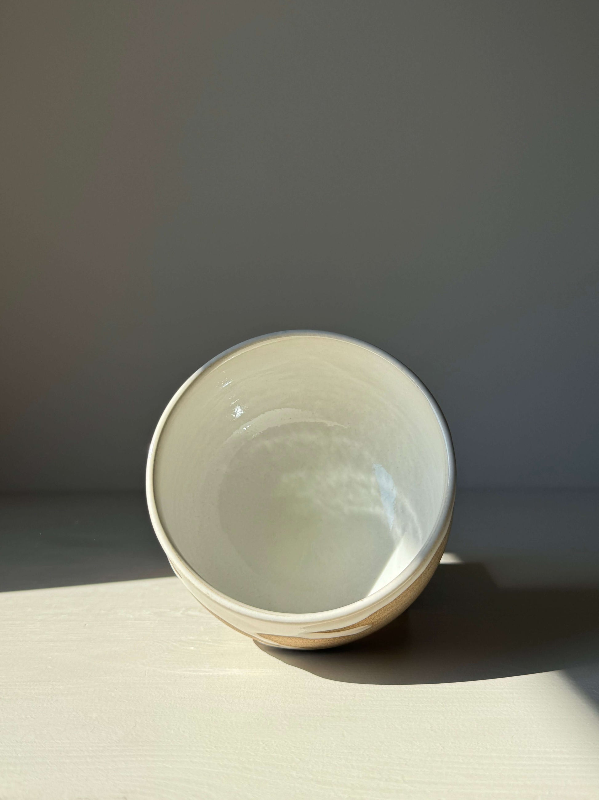 Handmade Matcha bowl from the Yuki Series, featuring toffee clay and glossy white glaze, ideal for a calming tea ritual.