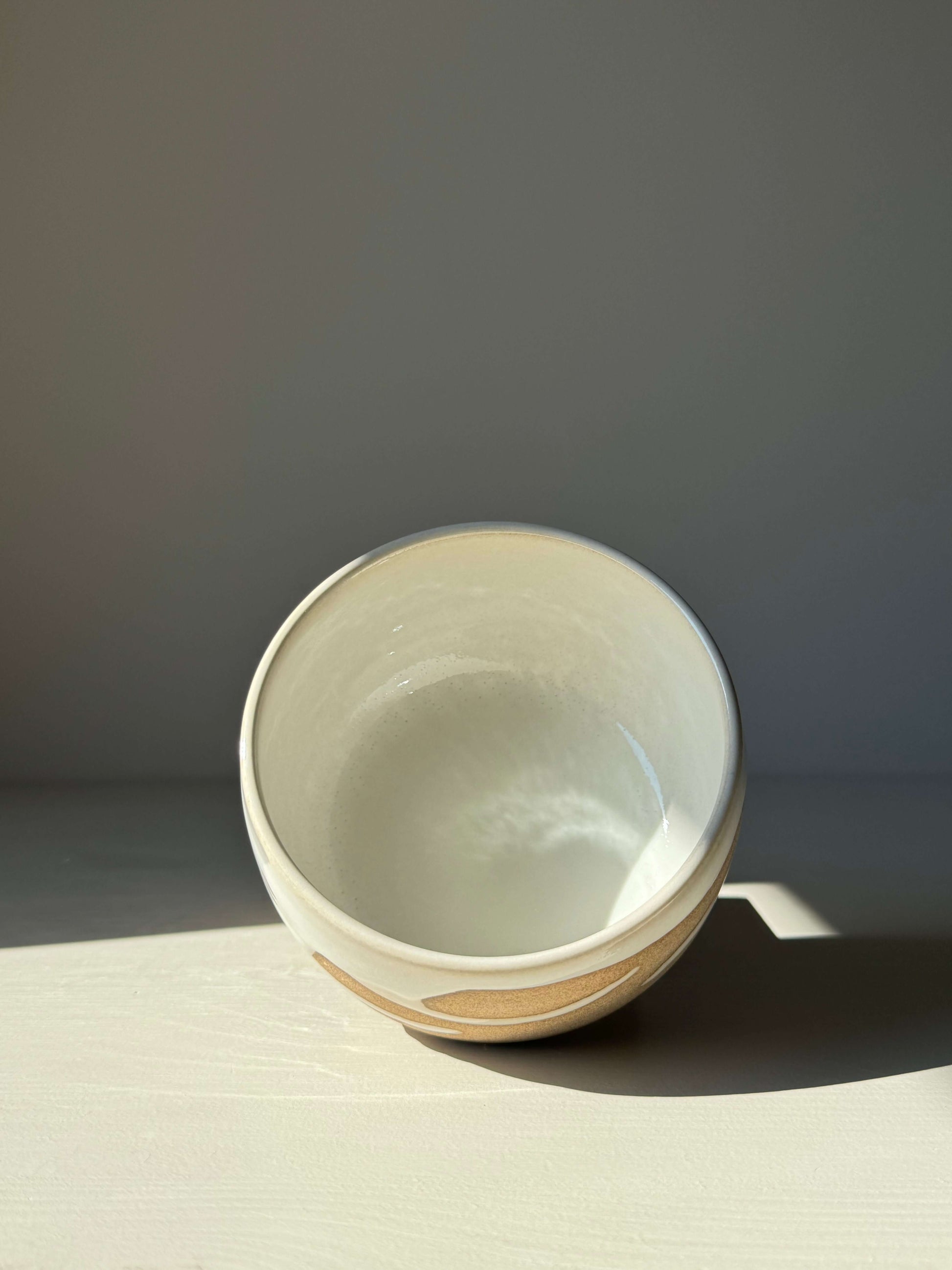 Handmade Matcha bowl from Yuki Series #10 with toffee clay and glossy white glaze, perfect for daily rituals.