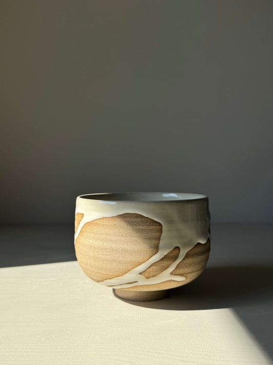 Handmade Matcha Bowl from Yuki Series #11 in toffee clay with glossy white glaze, wheel-thrown and unique with natural patterns.