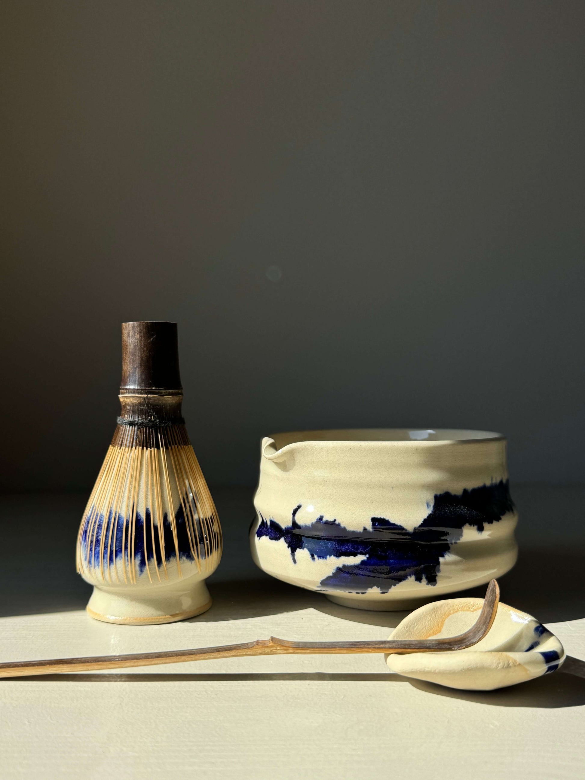 Cobalt blue Gosu Series matcha whisk holder with bamboo whisk and bowl set.