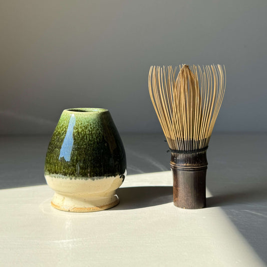Handmade ceramic Matcha Whisk Holder - Hinoki Series with bamboo whisk, glossy green glaze inspired by Hinoki tree for tea ceremony.