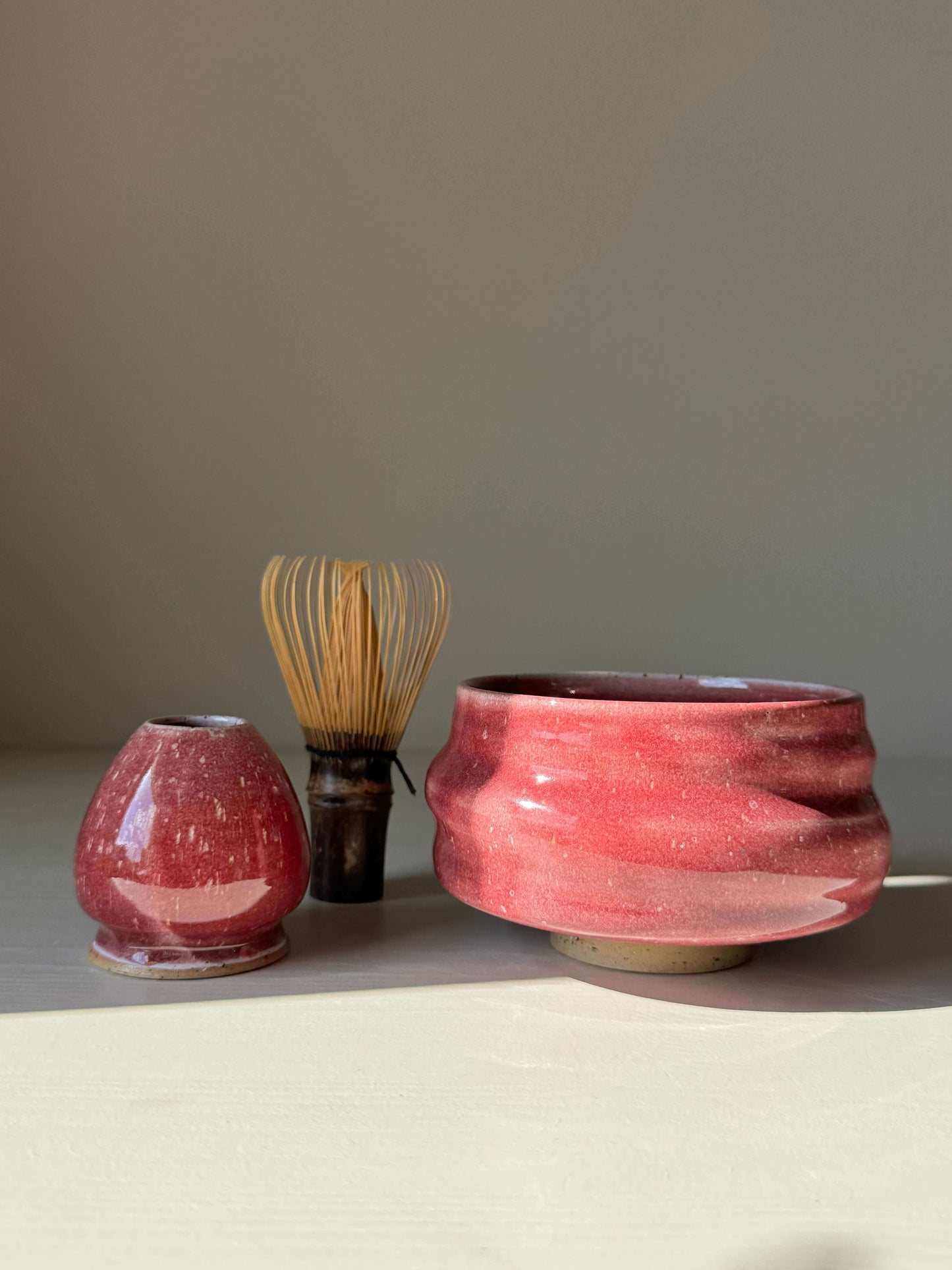 Matcha Whisk Holder - Ume Series in handmade ceramic alongside whisk and bowl.