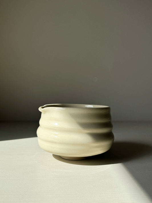 Handcrafted matcha bowl with spout, featuring clear glaze and subtle ridges, 7.5cm height x 11cm diameter, perfect for smooth whisking.