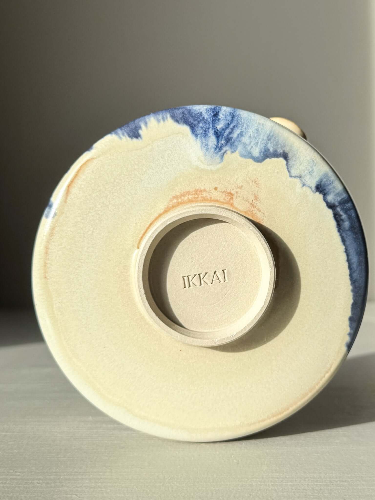 Bottom view of Matcha bowl Spout - Moonstone & Blue #01 with handcrafted glaze detailing in blue and moonstone tones.